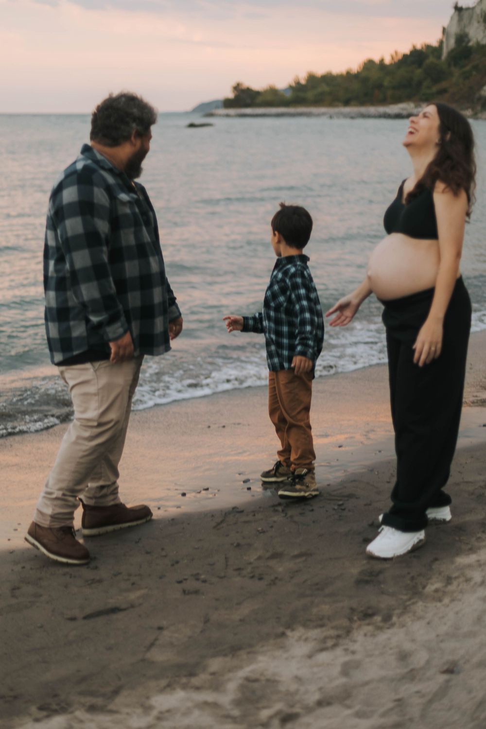family hanging at the lake in the sunset at Scarborough, Toronto