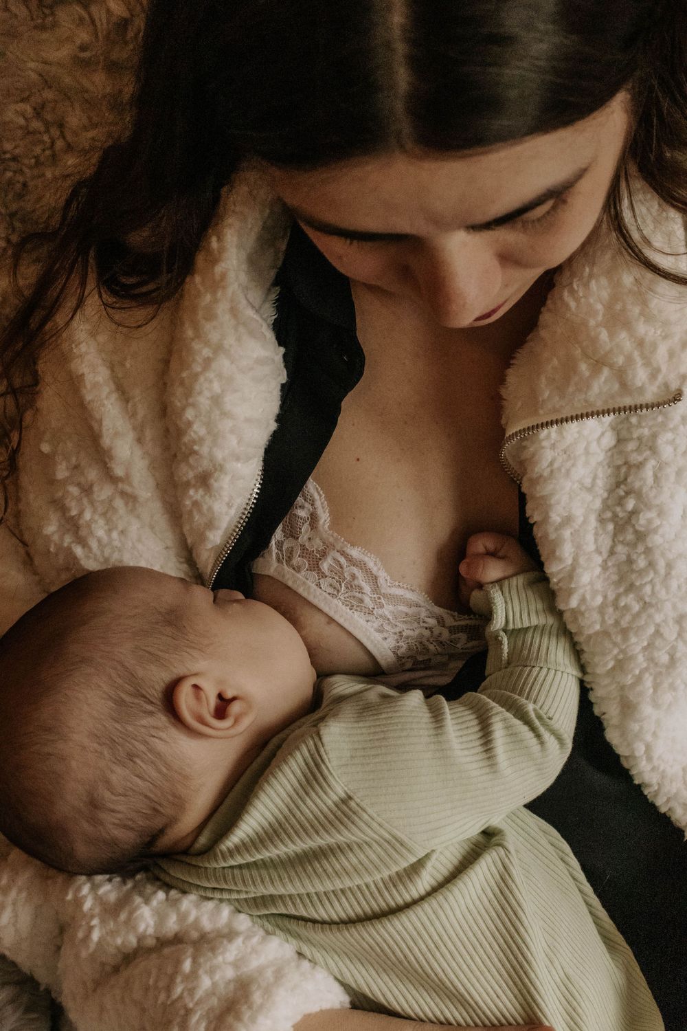 mothers breastfeeding her newborn. a shot taken from the top in Etobicoke, Toronto