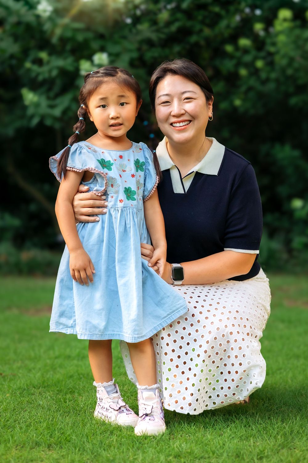 Mom and daughter pose together on grass at UGA's Founders Garden in Athens GA - Ansley Howe Photography