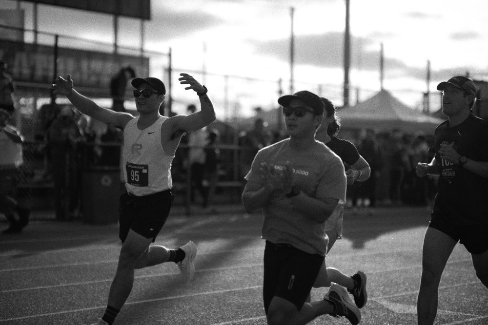 A sequence of black and white photographs showing a fitness training session in an outdoor urban setting.