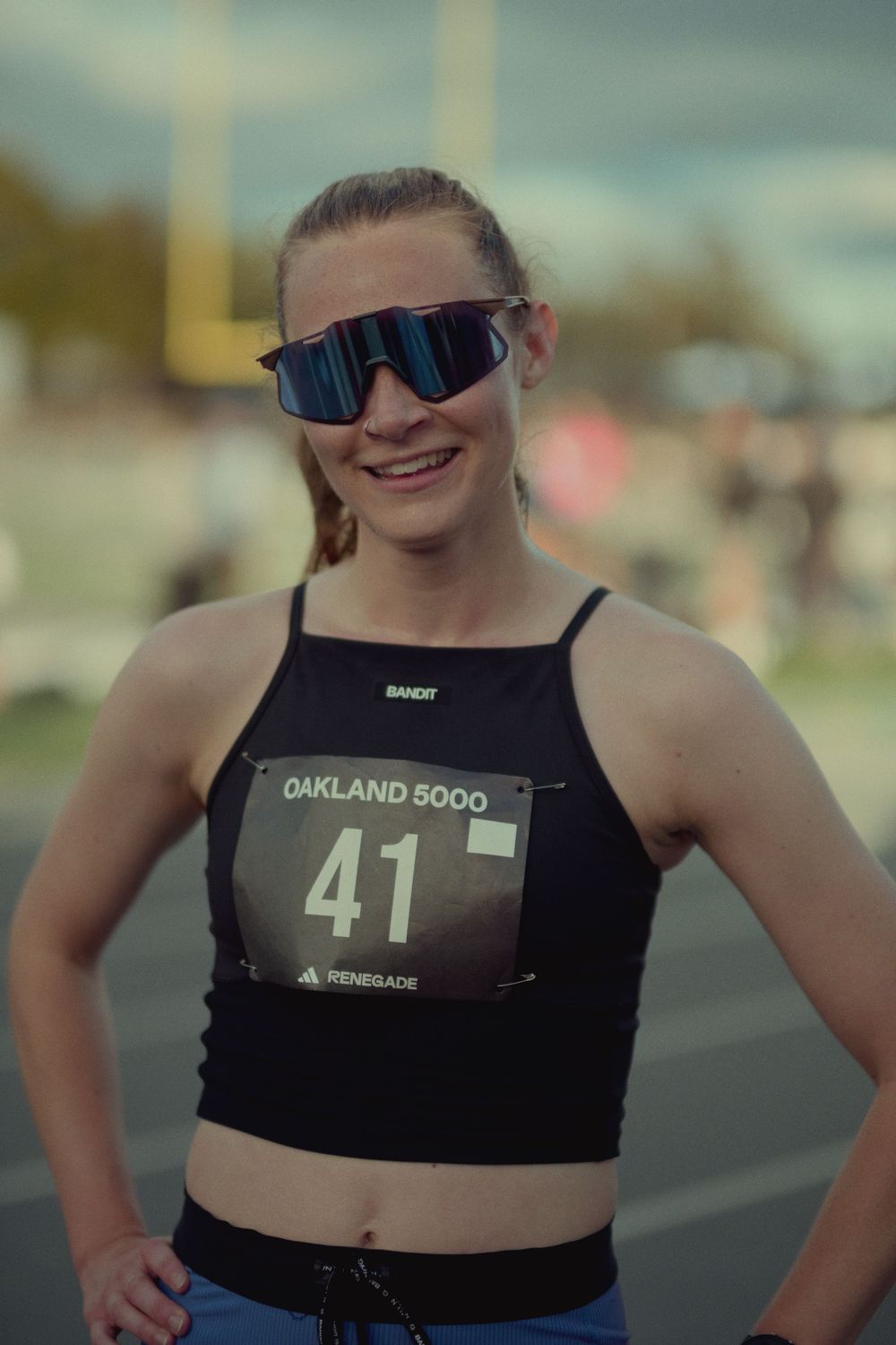 A cropped view of a person wearing a black athletic top with the number 41 and Oakland on it.