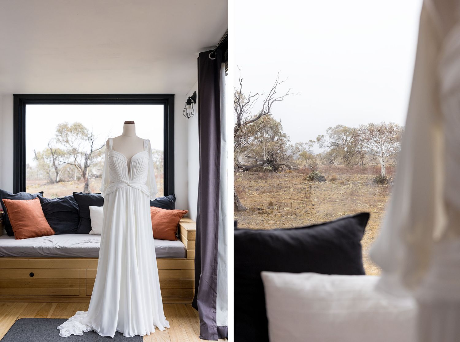 A bohemian wedding dress hanging by a window with rustic outdoor scenery and cushioned bench seating visible.