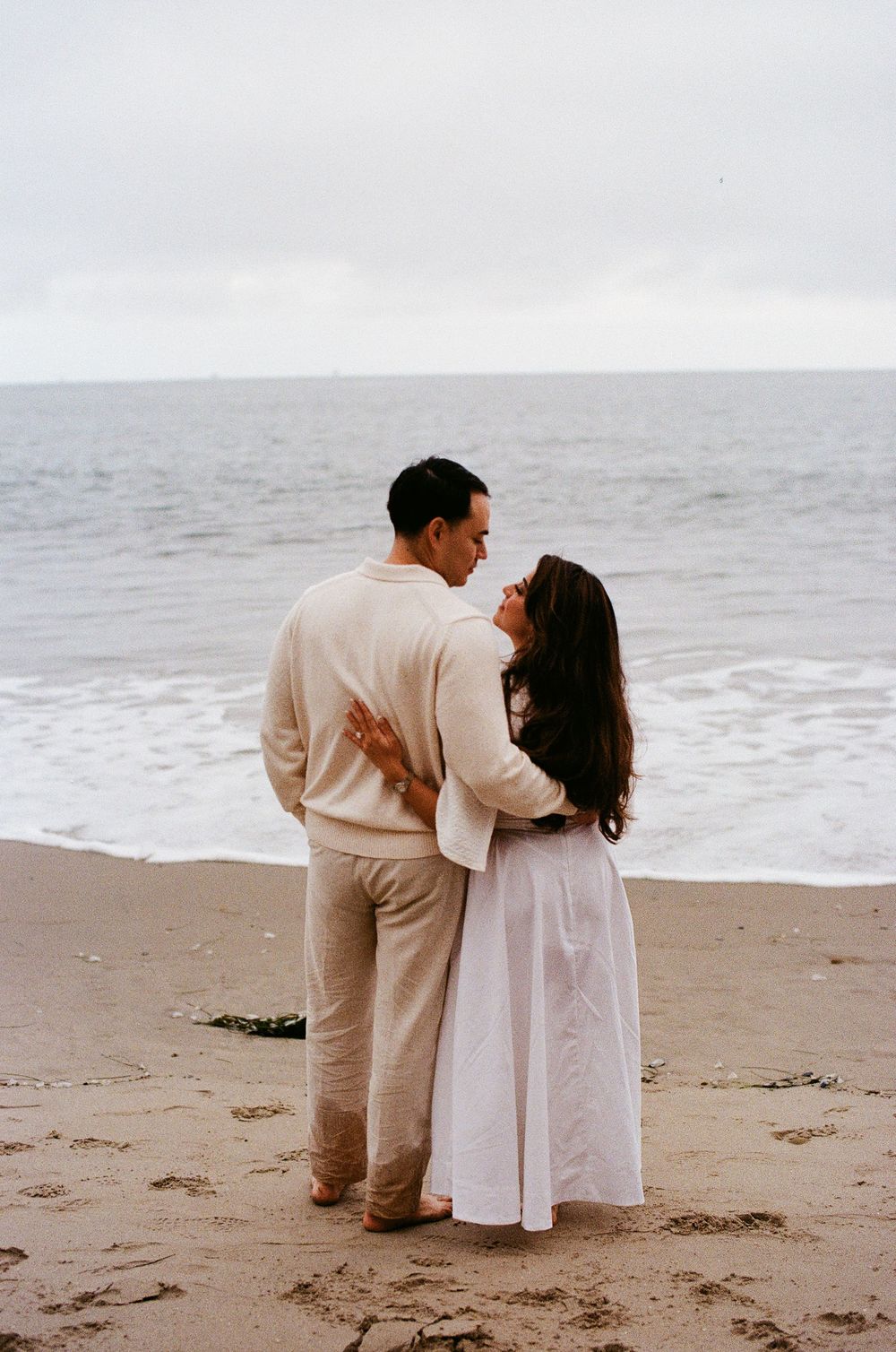 Genuine candid moment during a beach proposal in Southern California