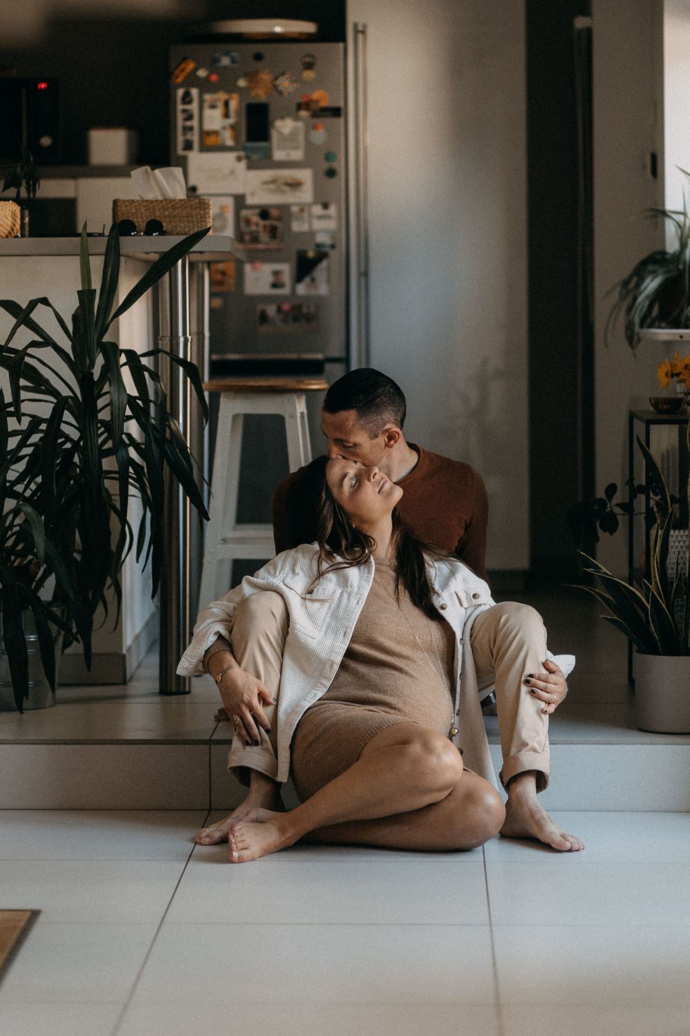 Intimate moment captured in a modern home interior with plants.