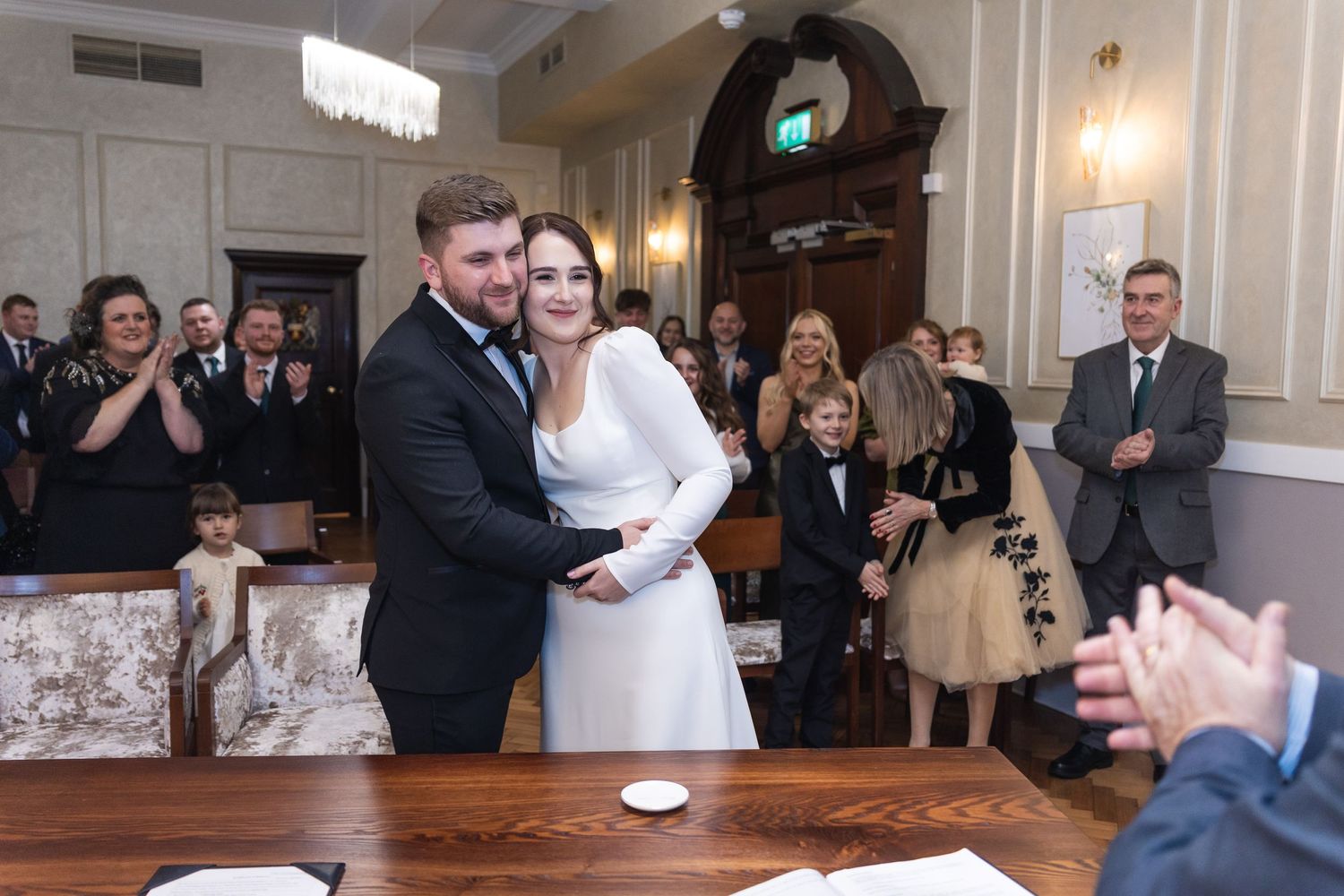 Relaxed and happy couple, just married, at Brydon room.