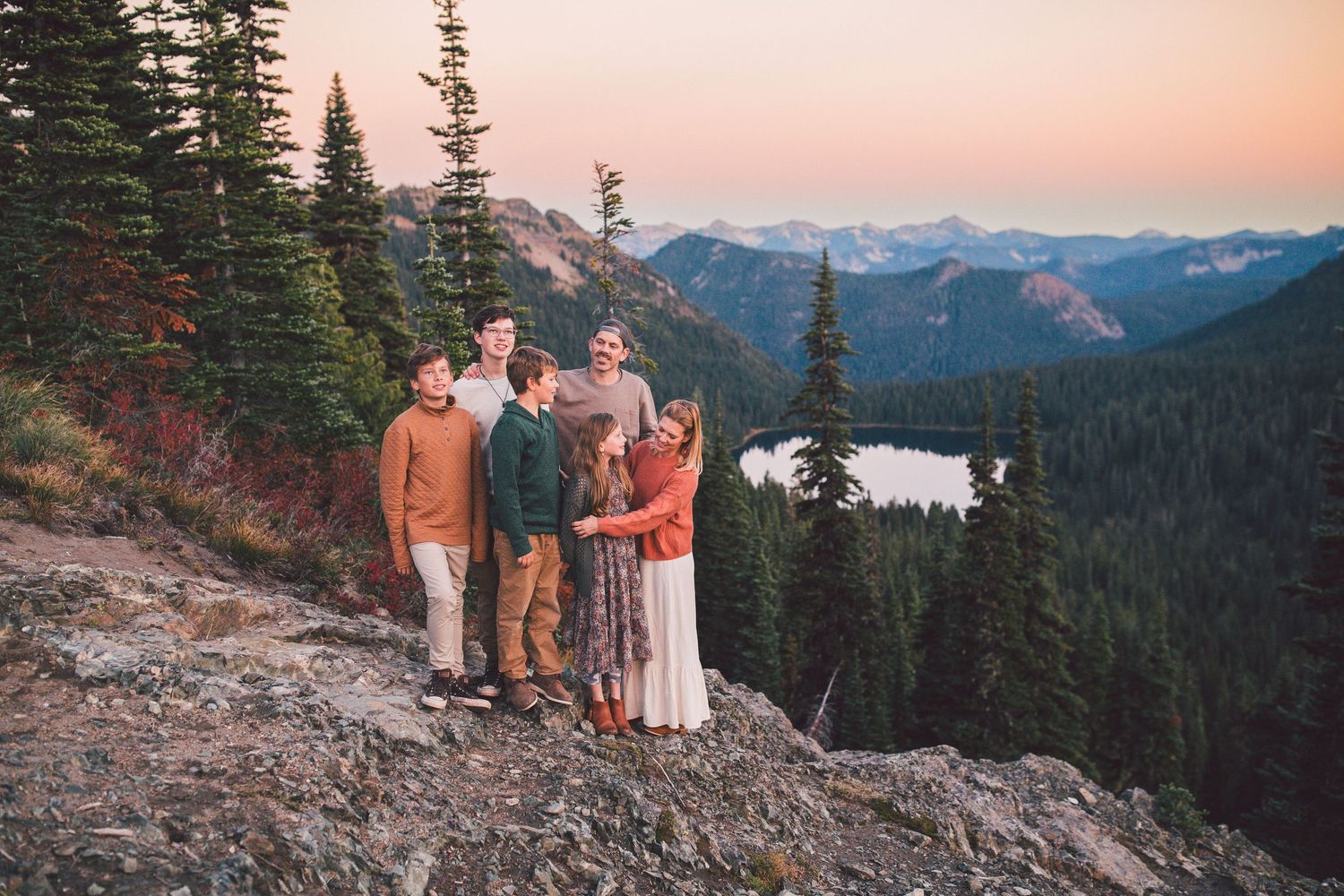 Family looking out on Mt. Rainier National Park at sunset in the Fall