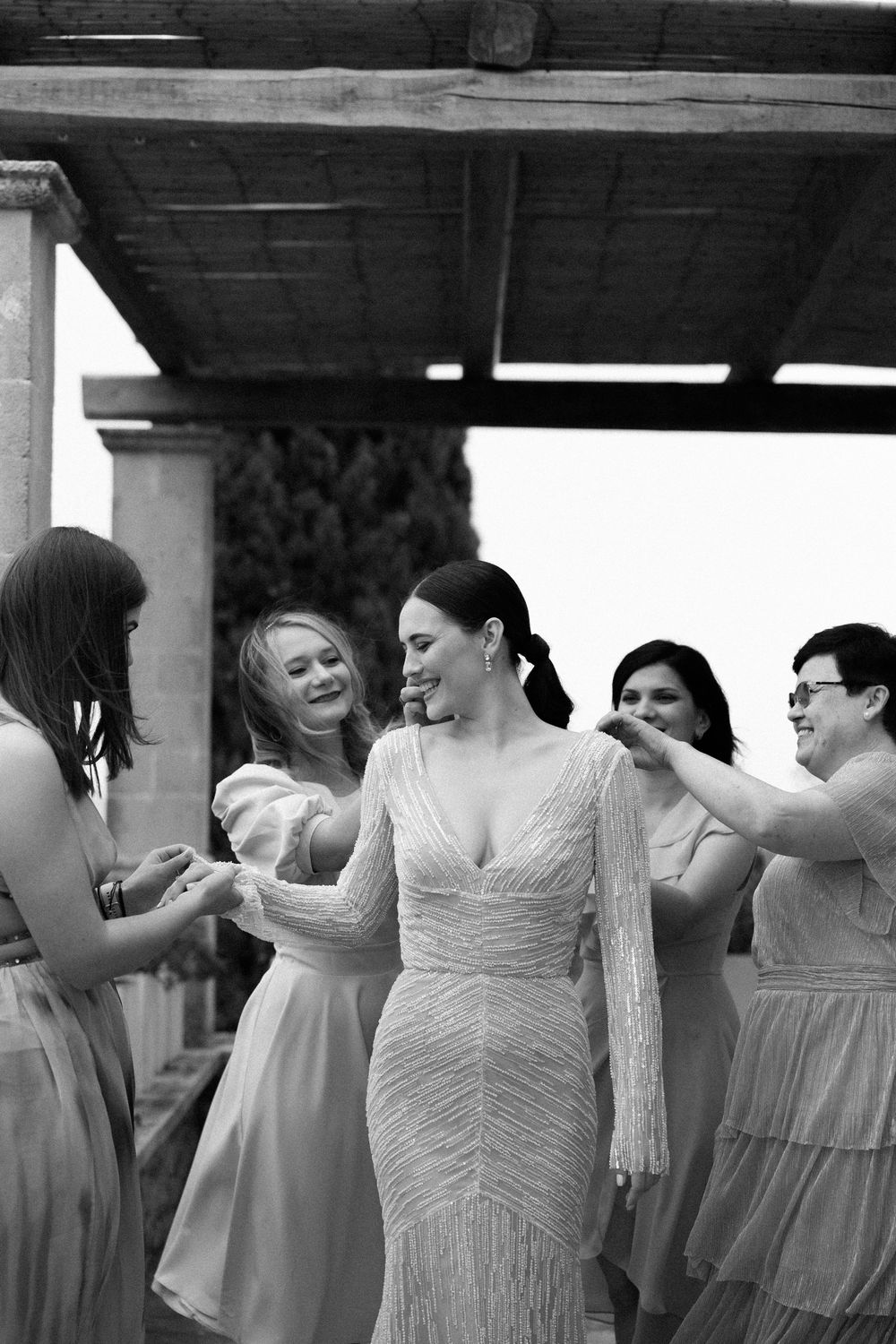A profile shot of a sparkling wedding dress with v-neckline against dark background. Wedding Agreco Farms, Crete