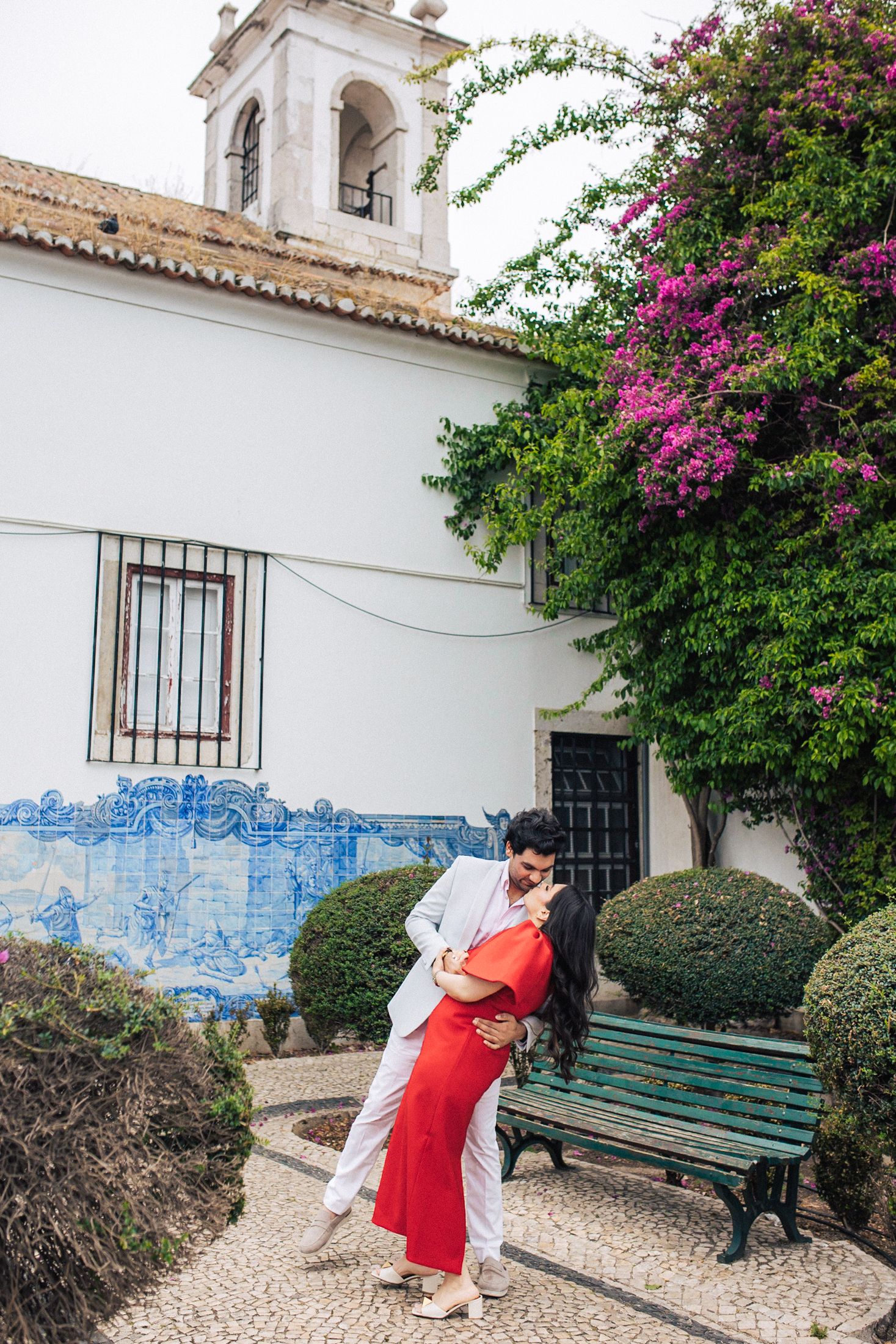Indian couple walking through the streets of Baixa, Lisbon during their engagement session.