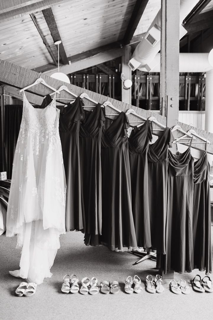 Bridal gown and bridesmaids dresses displayed on starecase - black and white - duluth wedding