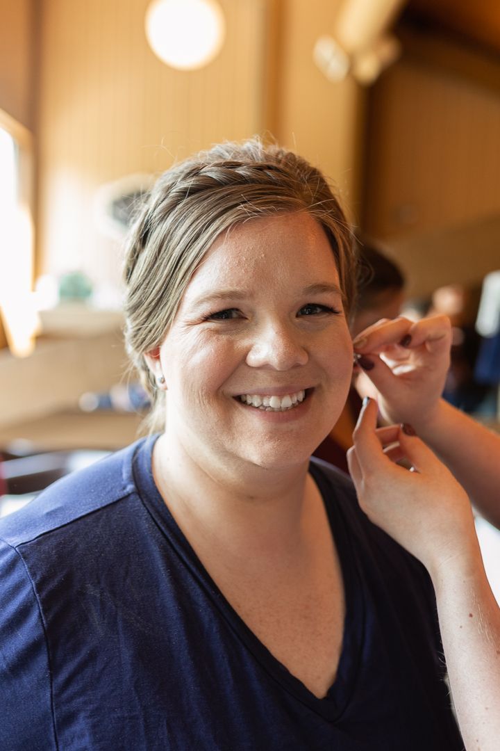 Detail photo of bride putting in earrings Duluth Minnesota Wedding
