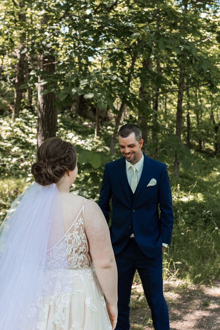 First look of Bride and Groom at Spirit Mountain in Duluth - Groom turns around