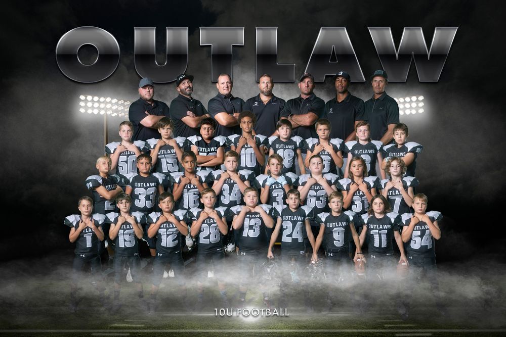 Large youth sports team photo with players and coaches arranged in formal rows with dramatic lighting.