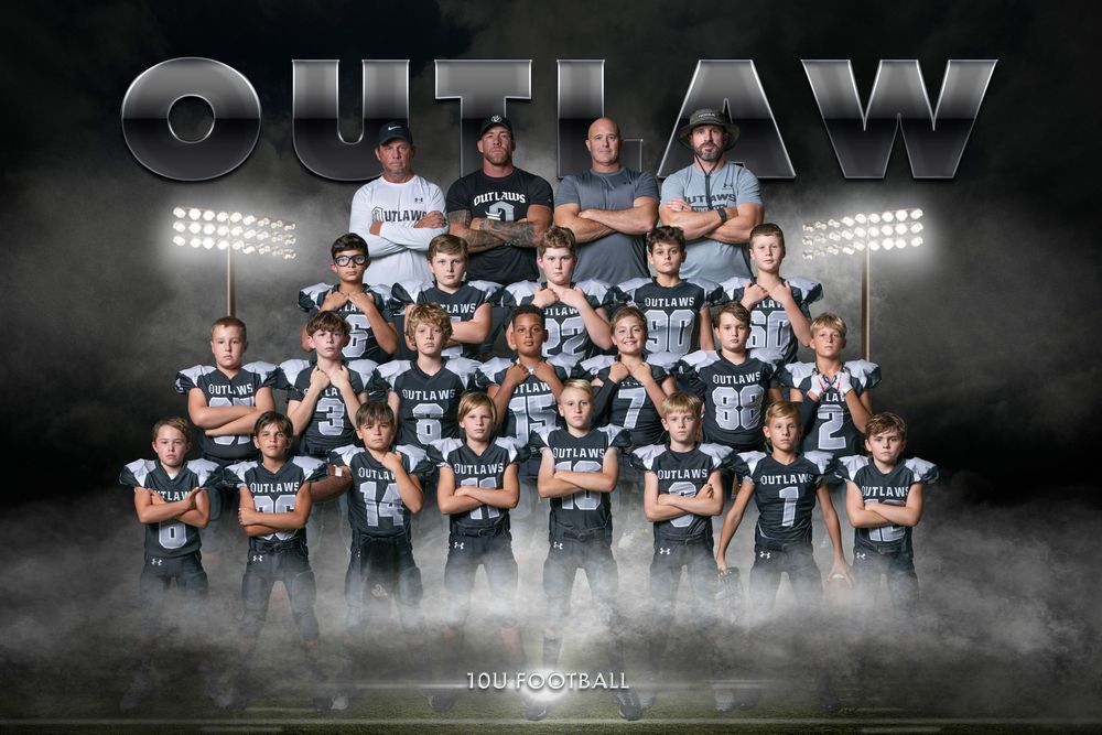 Football team group photo showing players in light jerseys posed in organized rows with foggy lighting effects.