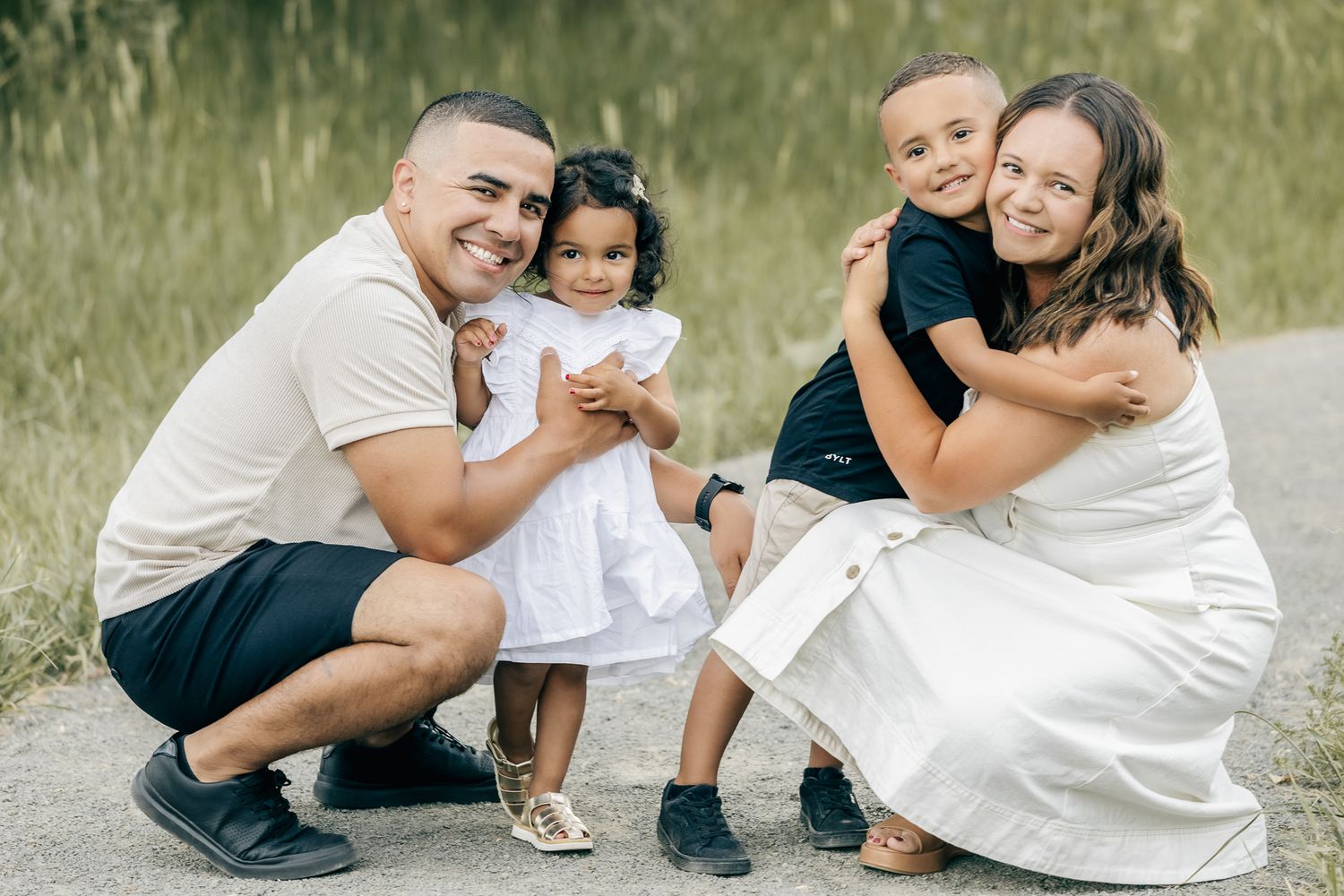 professional colorado family photo session in rocky mountains family of 4 posing in the mountains during sunset golden hour time. liz rivas