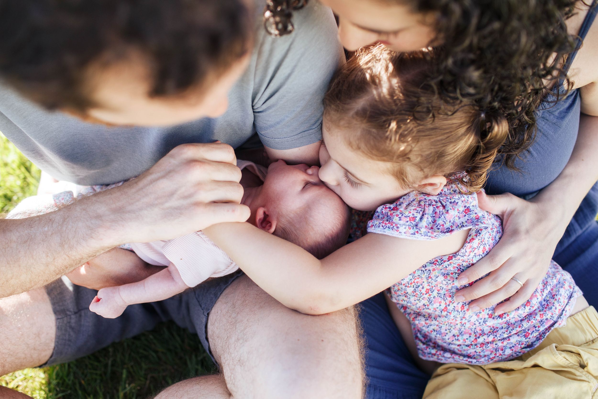 Seattle family photographer: A family photo session with a toddler and a newborn baby on a sunny evening in Mukilteo WA