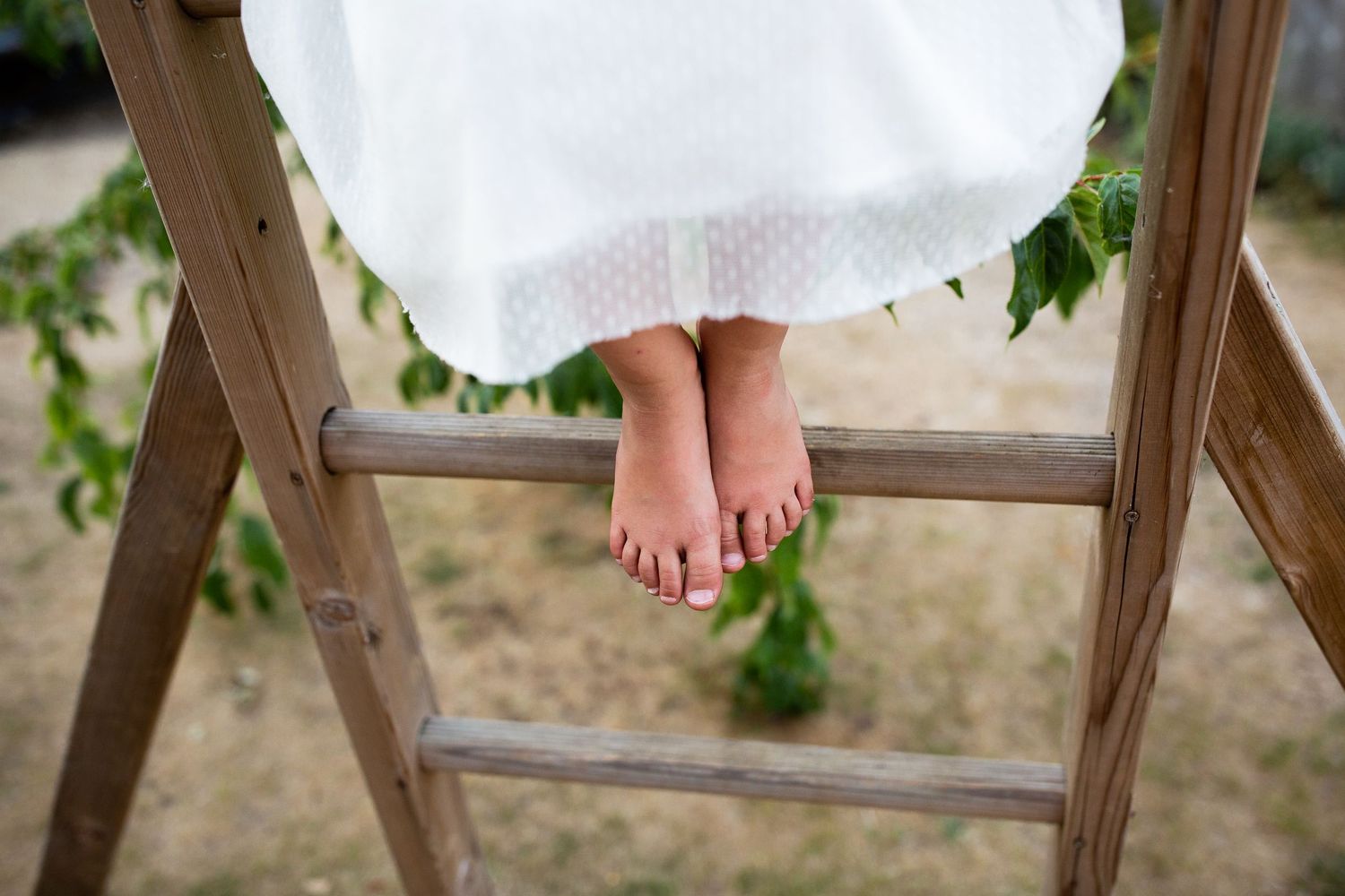 Girl playing in the garden with outdoor kitchen