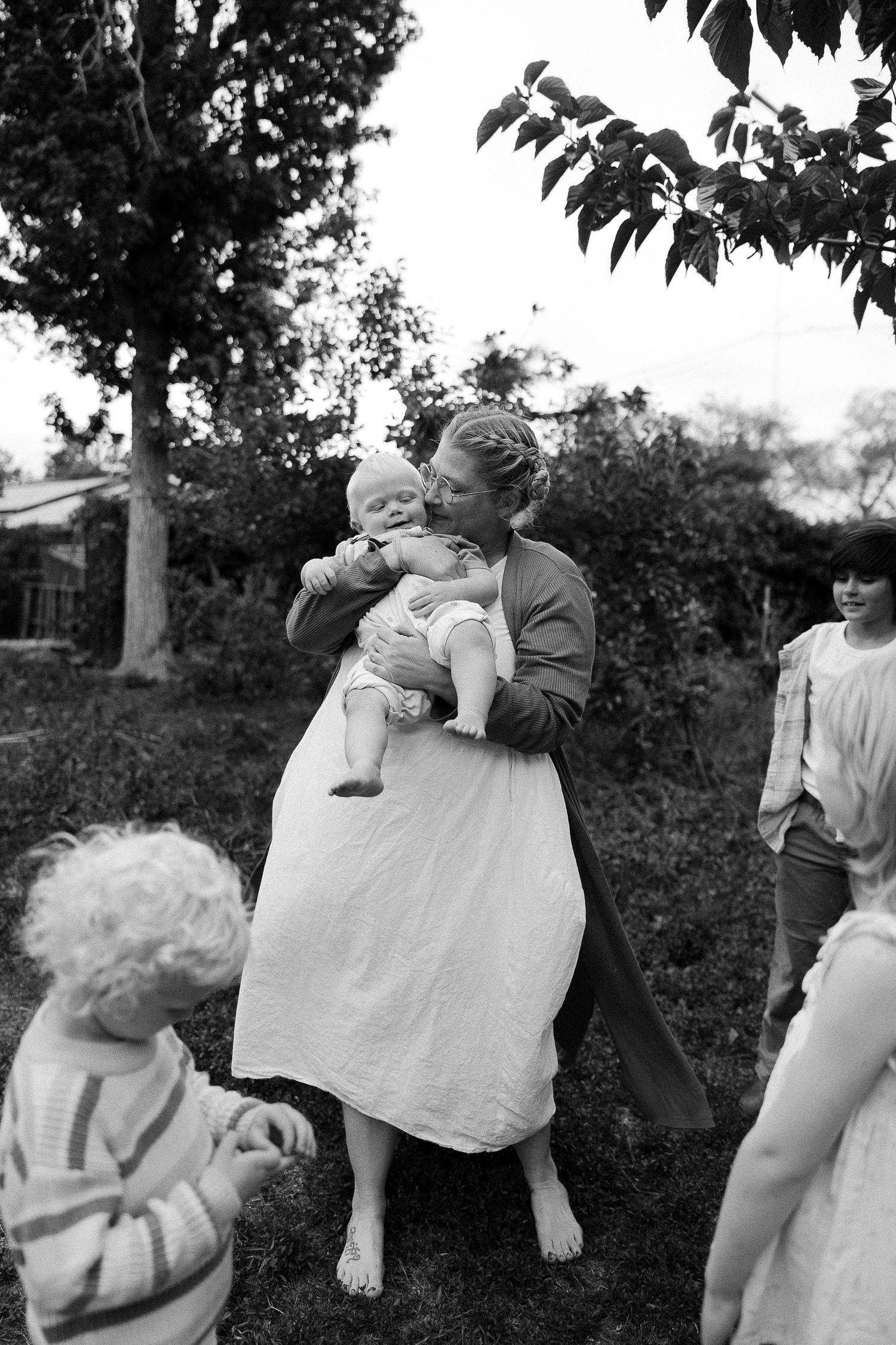 Multiple black and white photos show a couple dancing together outdoors in vintage attire.