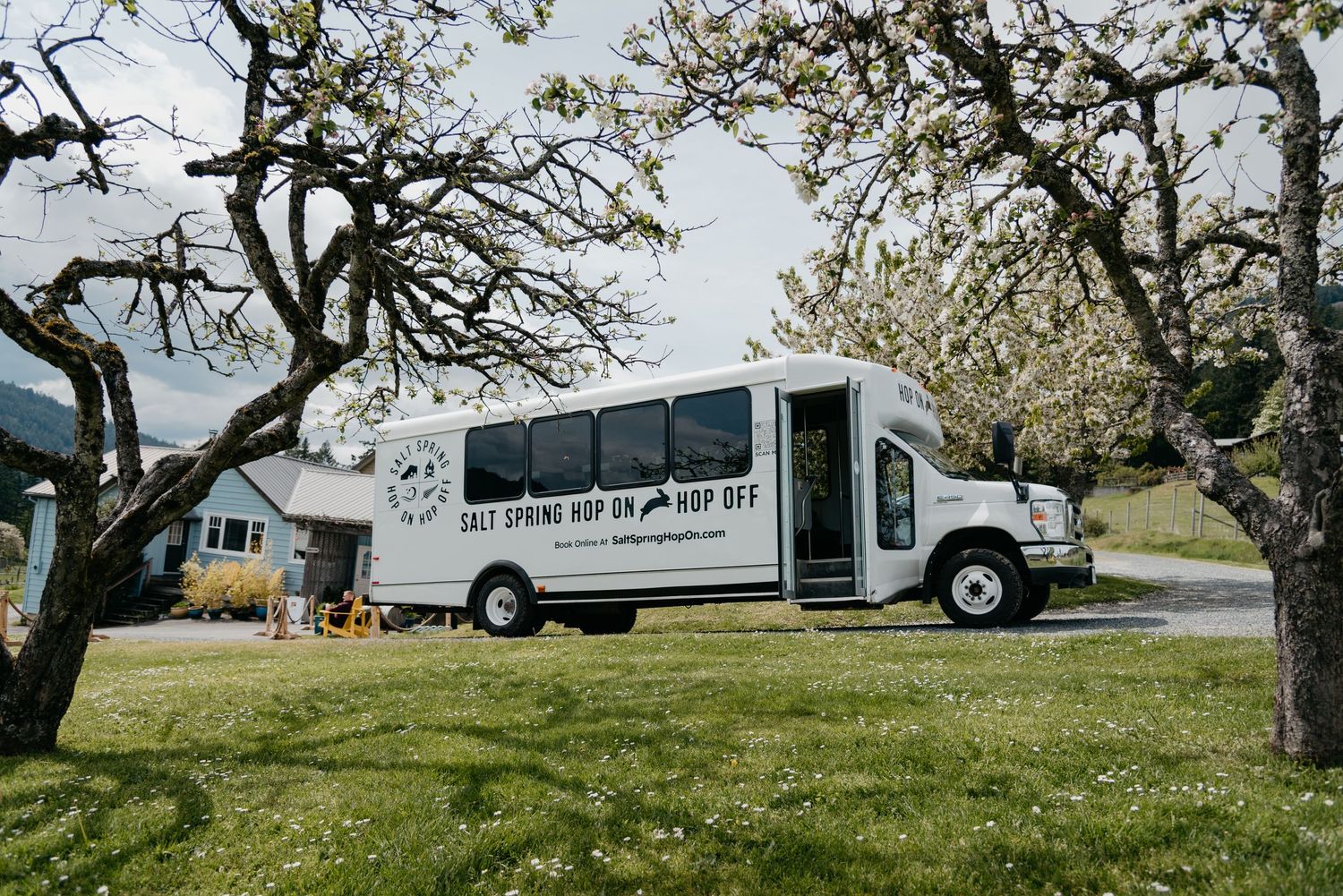 Salt Spring Hop On Hop Off bus parked outside of garry oaks winery on Salt Spring Island in the Southern Gulf Islands