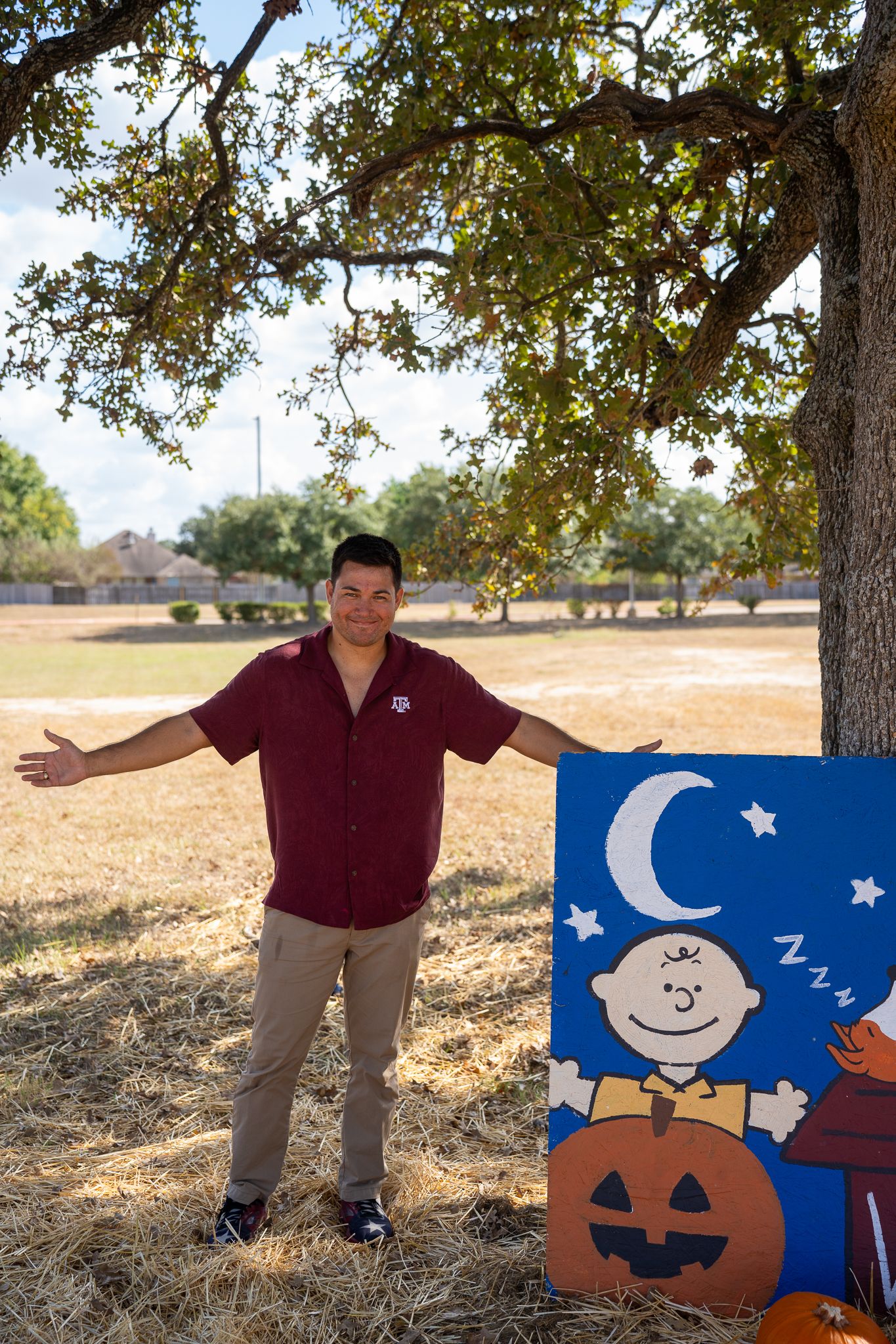 Isaac at a pumpkin patch in College Station, Texas, enjoying autumn fun and the festive atmosphere.