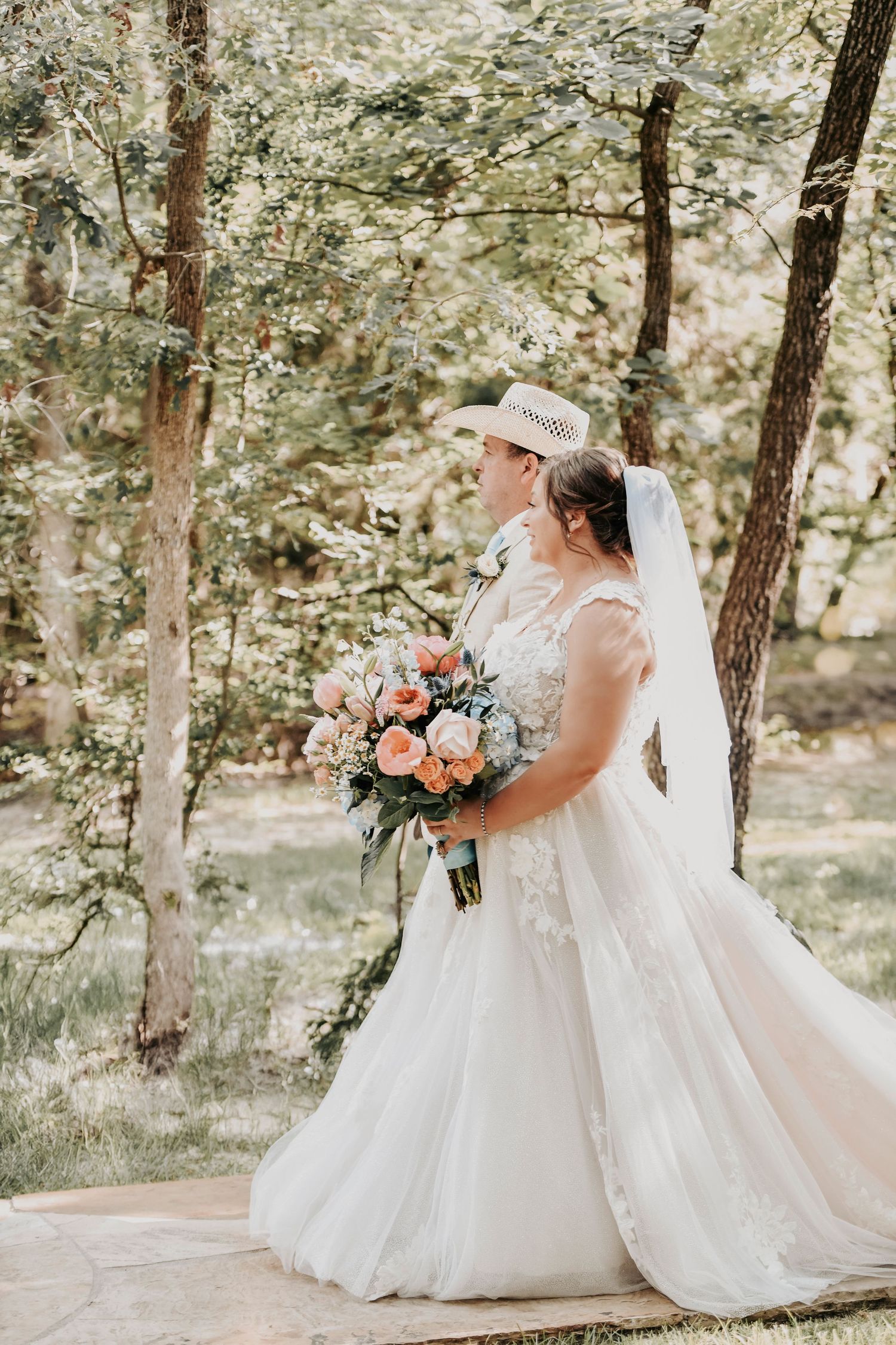 Proud dad walking his daughter down the aisle while guests watch