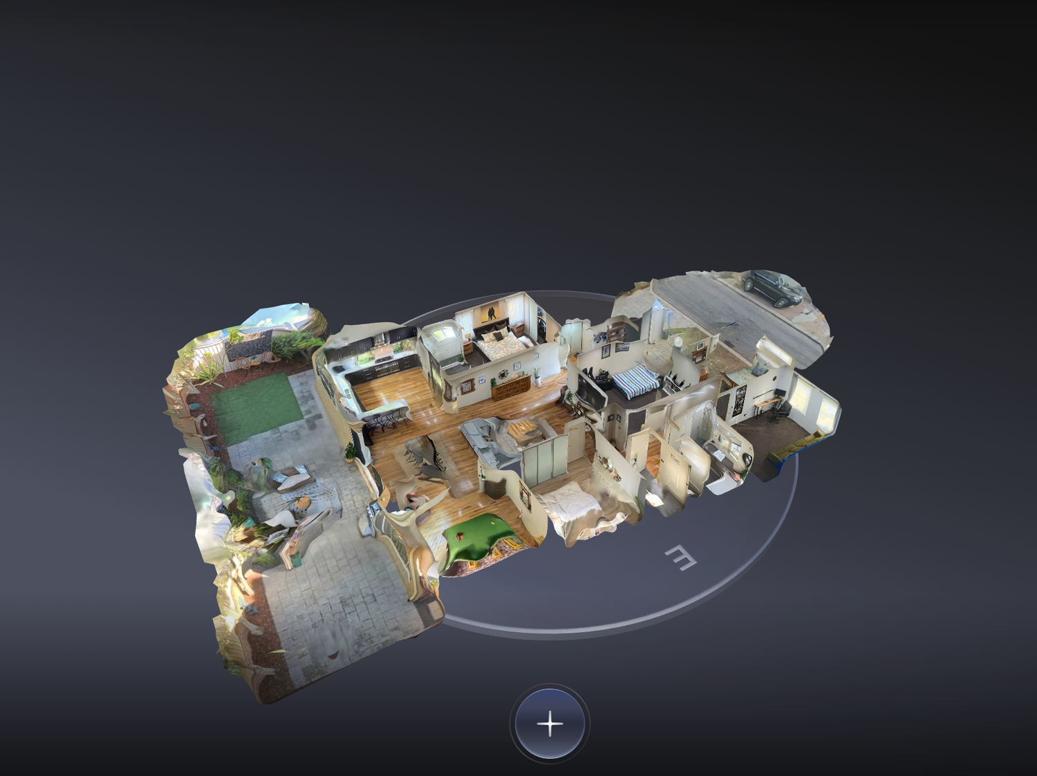 3D interactive dollhouse view of an unfurnished residential floor plan with white walls and hardwood floors.