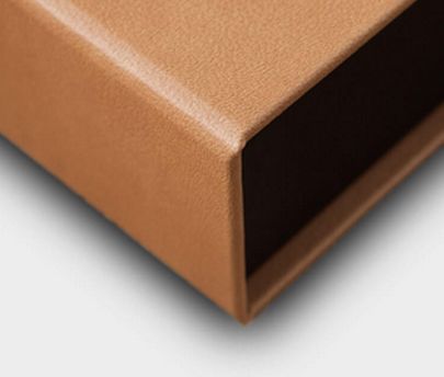 Folded brown leather rectangular piece shown at multiple angles against white background displaying craftsmanship details.