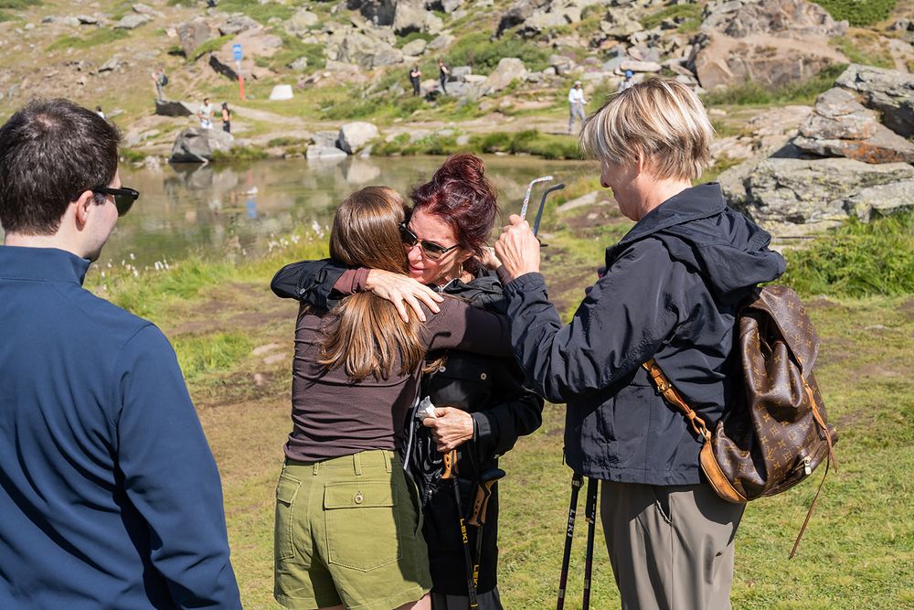Surprise proposal in Zermatt by an alpine lake with Matterhorn view, emotional moments and family celebration in the Swiss Alps.