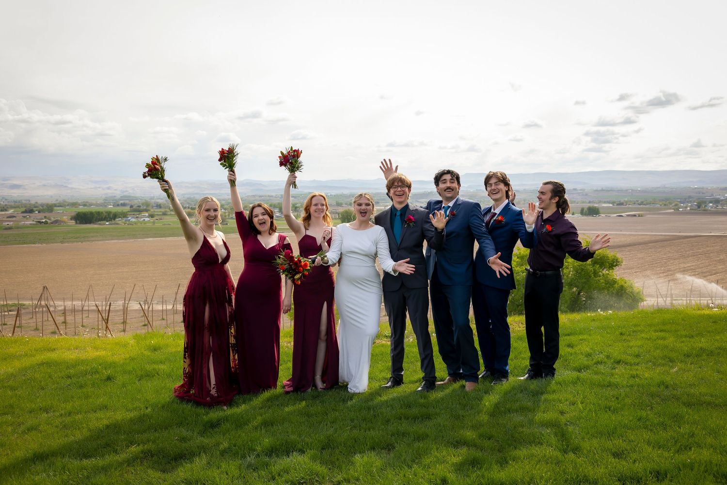 bridal party wearing jewel tones selebrating