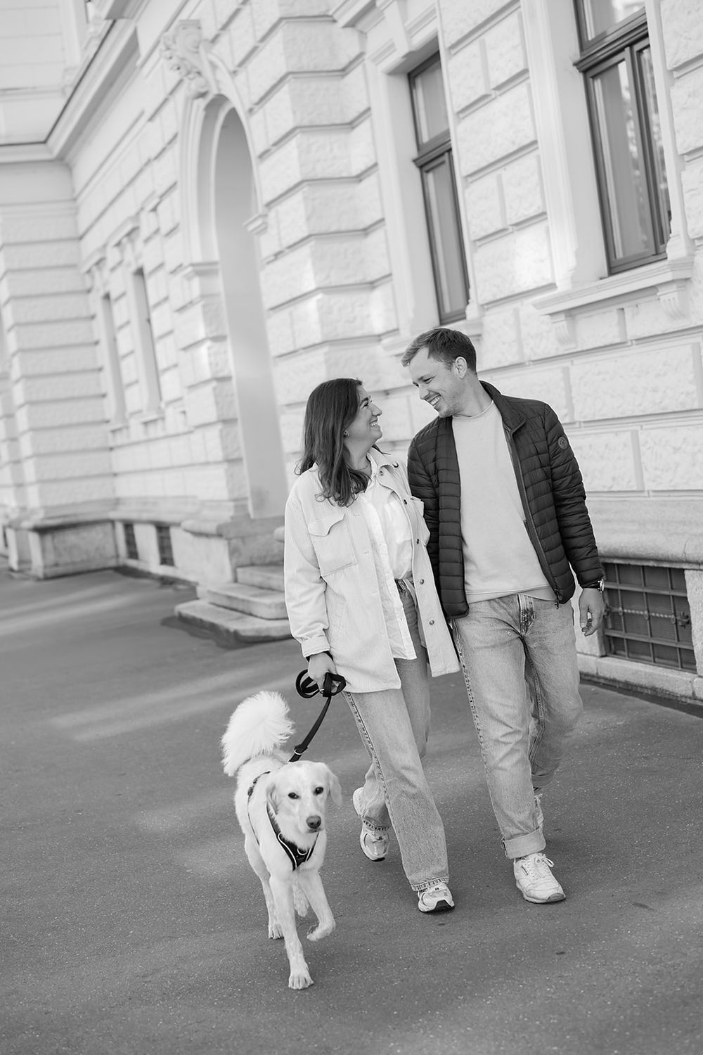 Modern young couple's simple engagement photo session with their fluffy dog in the city of Zurich, stylish and full of joy