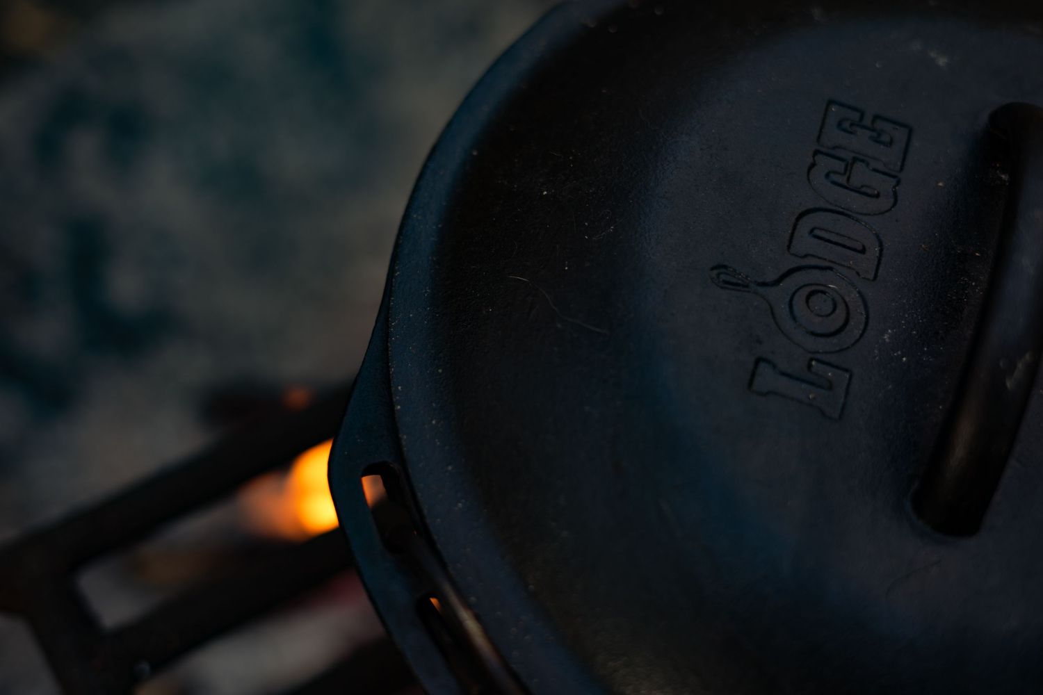 Lodge Dutch oven over an open fire, perfect for outdoor cooking and campfire meals.