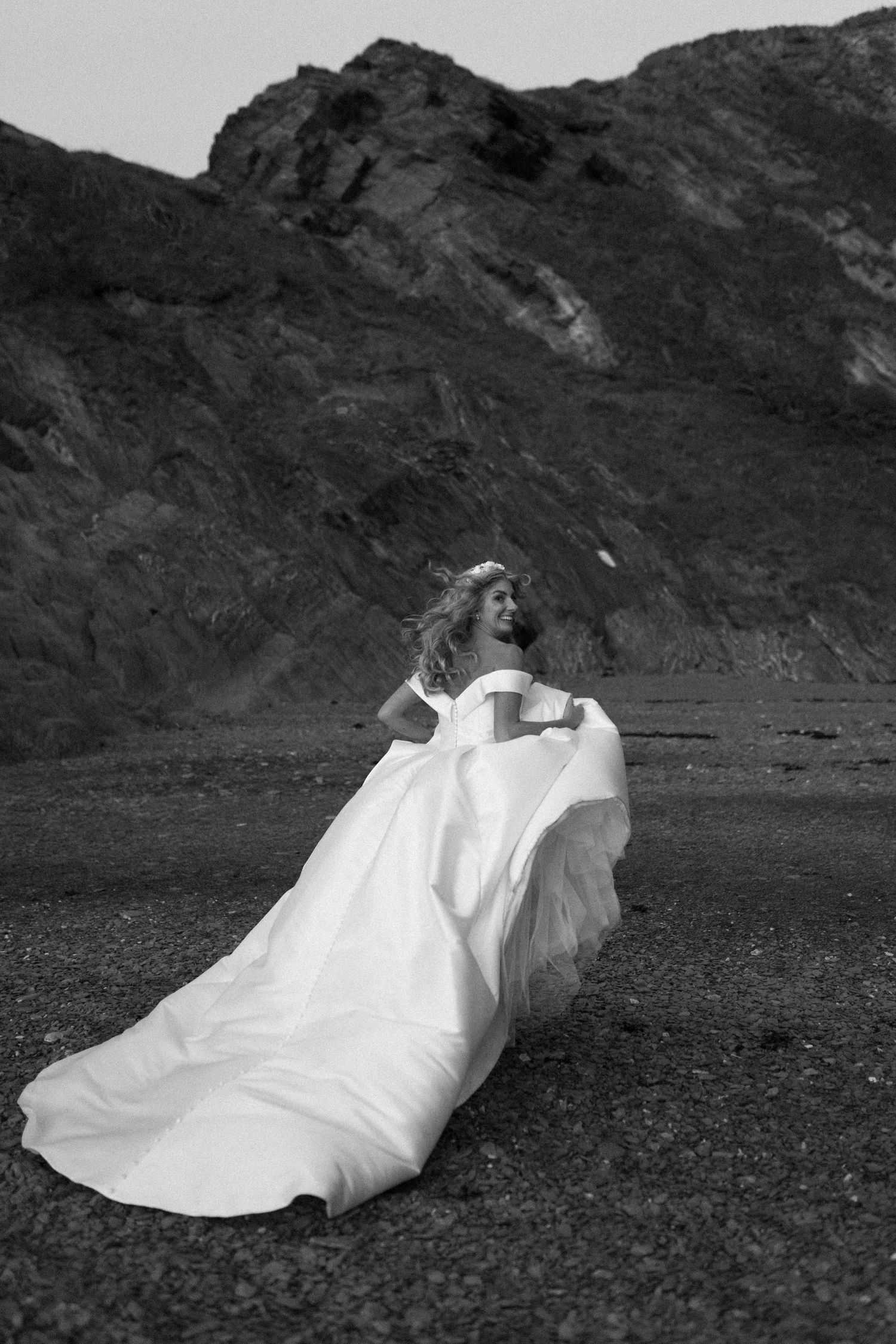 Bride in elegant beach wedding dress on the beach at Tunnels Beaches