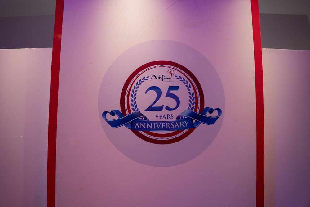 Purple and blue gradient banners displaying a 25th anniversary celebration logo.