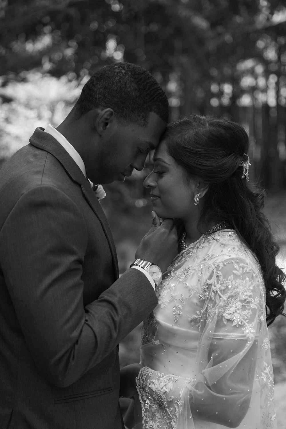 A tender intimate wedding moment captured in black and white showing a couple on their wedding day at a colorado hotel