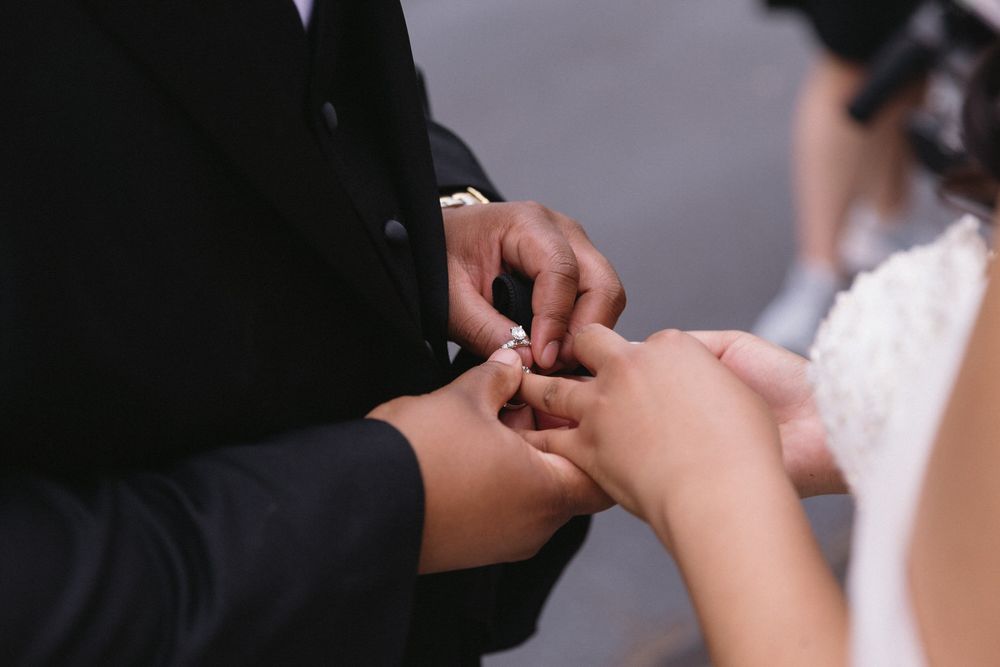 Close-up shot of hands exchanging rings during an elegant elopement ceremony in asheville north carolina