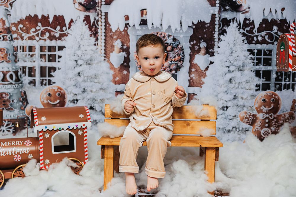 A series of photo booth style images in wooden frames capturing candid moments against a rustic backdrop.