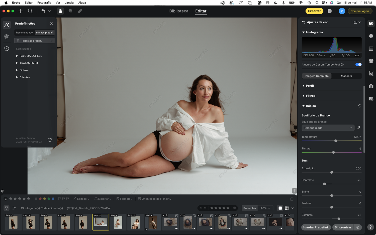 A side-lying figure in a white robe poses for an artistic photo in a photography editing software window.