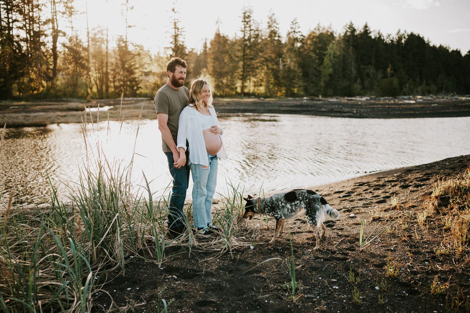 Maternity session in Union Bay couple holding hands by ocean on Vancouver island Maternity and Outdoor natural light photographer
