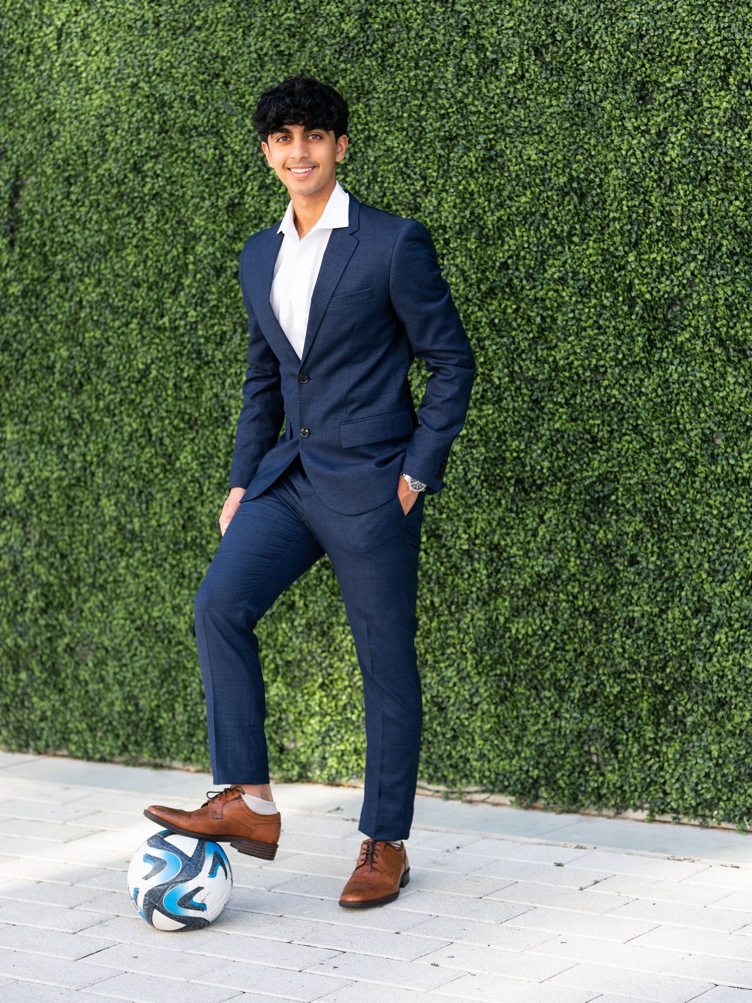 Guy senior photo session Legacy West Plano Texas with soccer ball