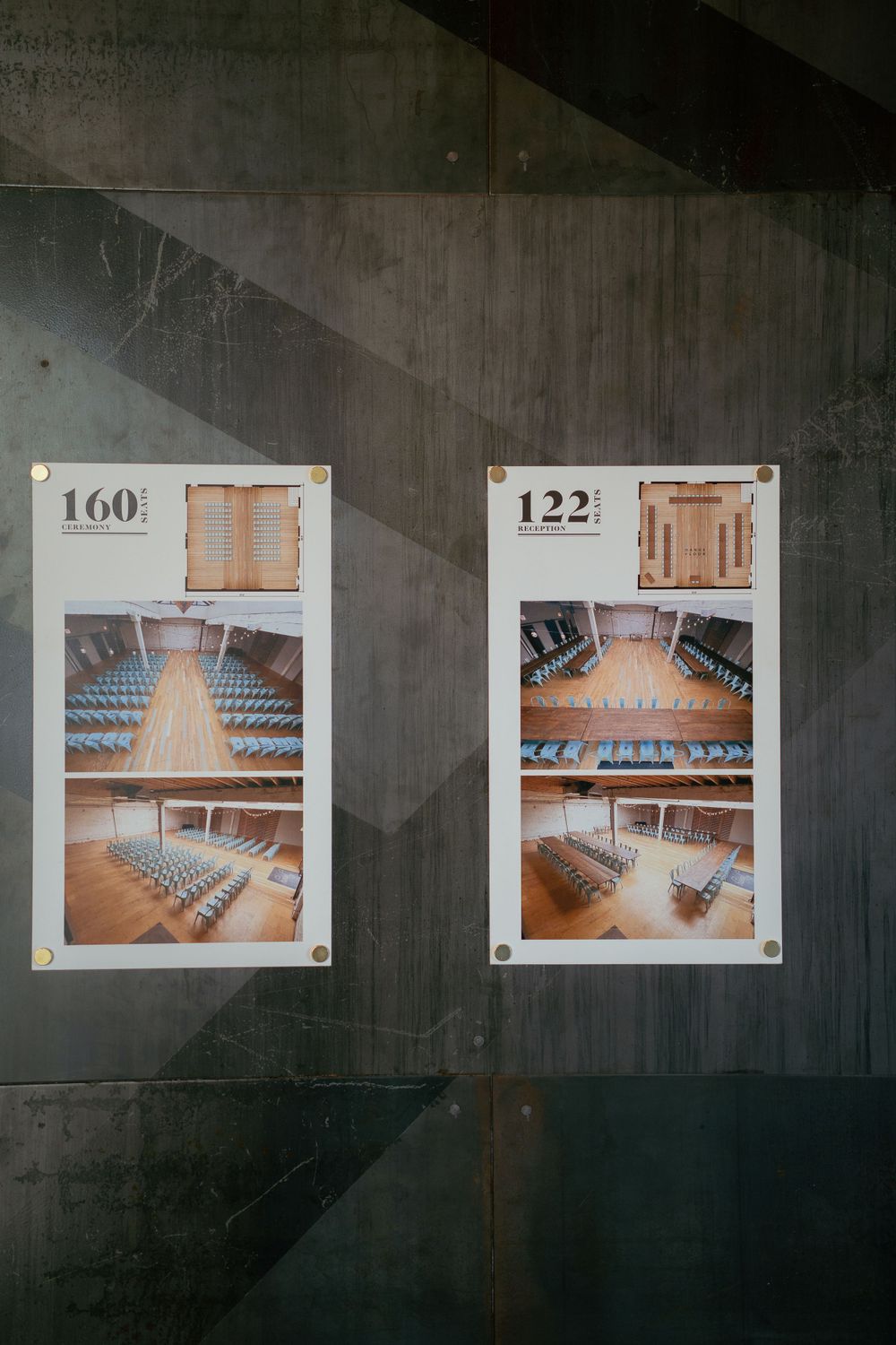 Two photos posted on a wall showing empty auditorium seating layouts numbered 160 and 122 in a conference venue.