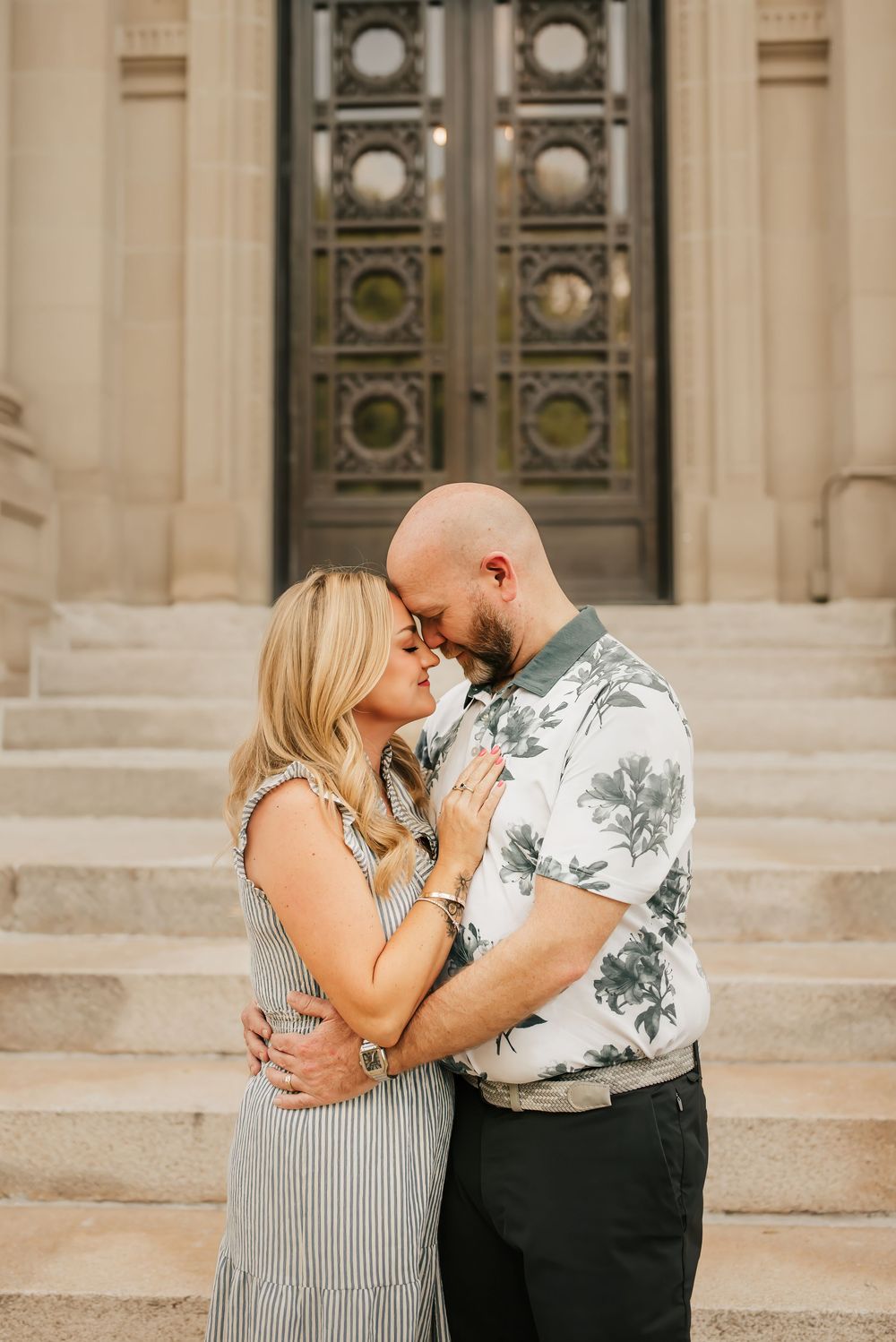 sweet couple cuddles up on date in Washington park