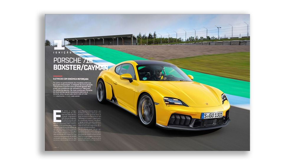 A bright yellow Porsche sports car drives on a race track with green runoff areas visible in the background.