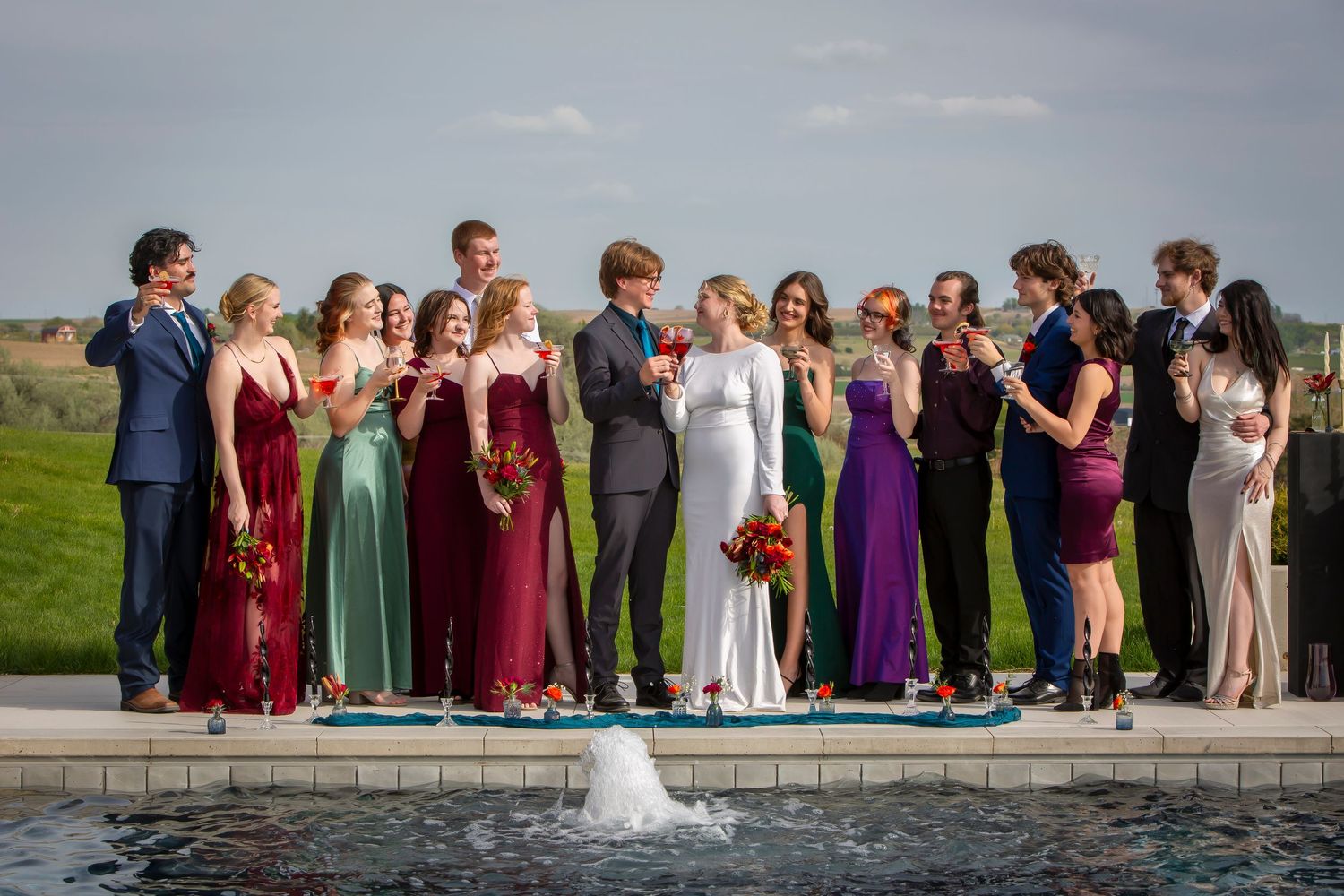 bridal party and guests 'toasting" the newlyweds