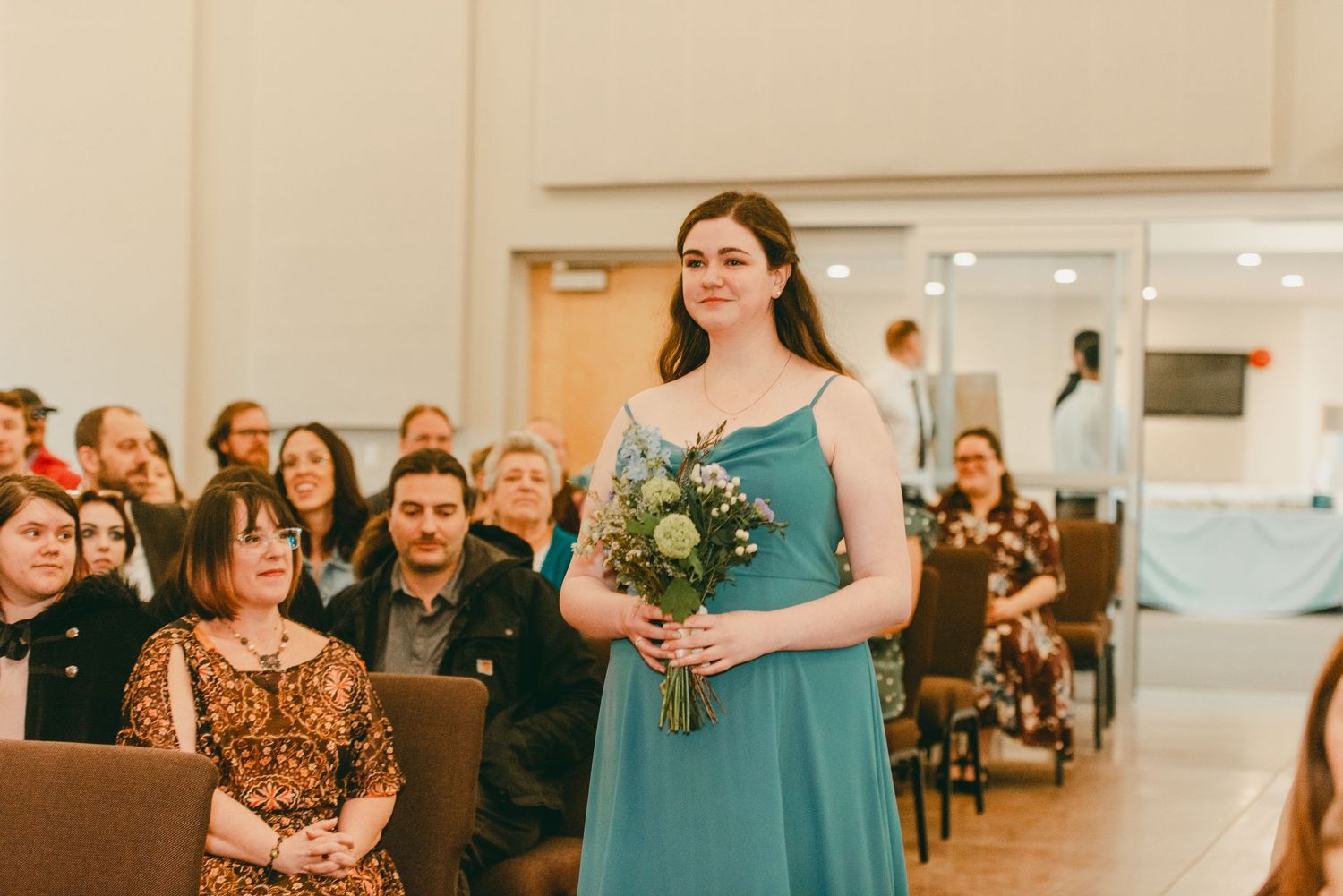 Maid of honour walks down aisle