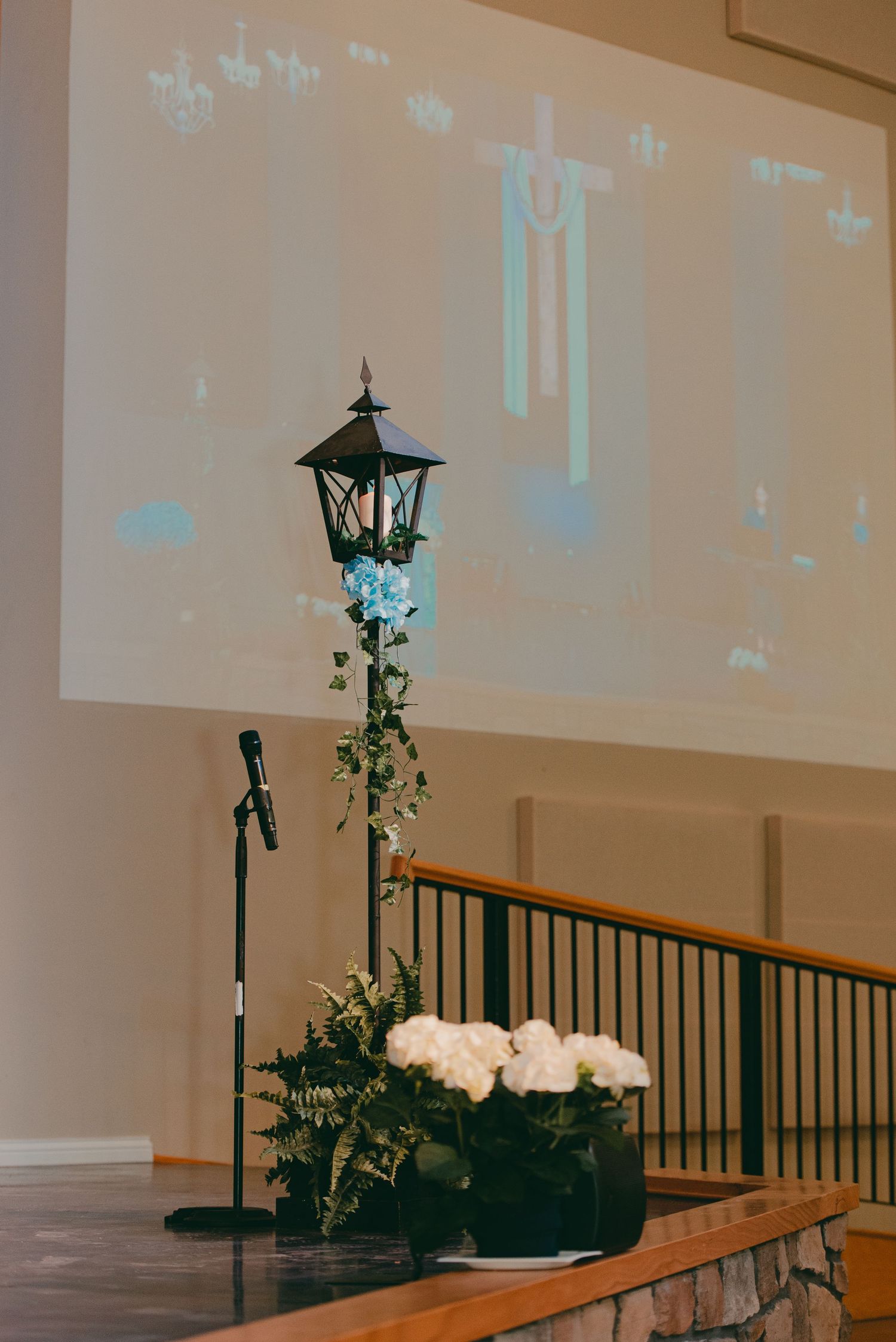 Detail shot of ceremony decoration lampost and flowers