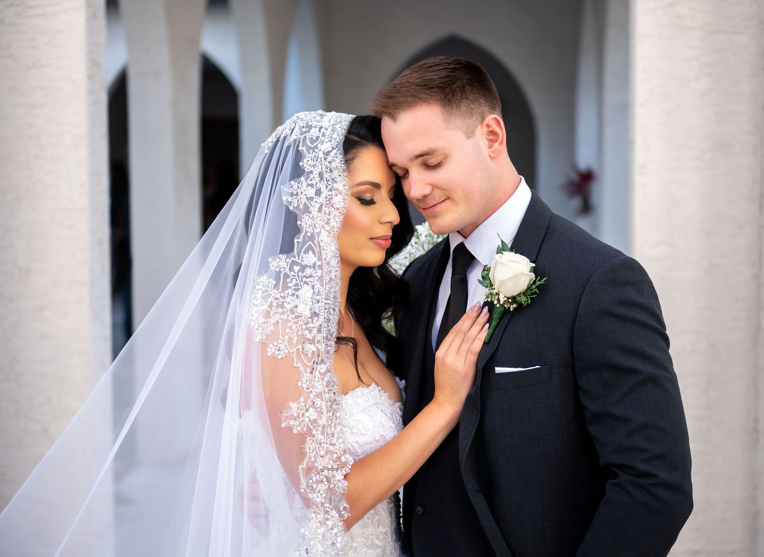 Intimate first dance under string lights at a Tampa waterfront venue, documented by experienced South Florida wedding photographers.