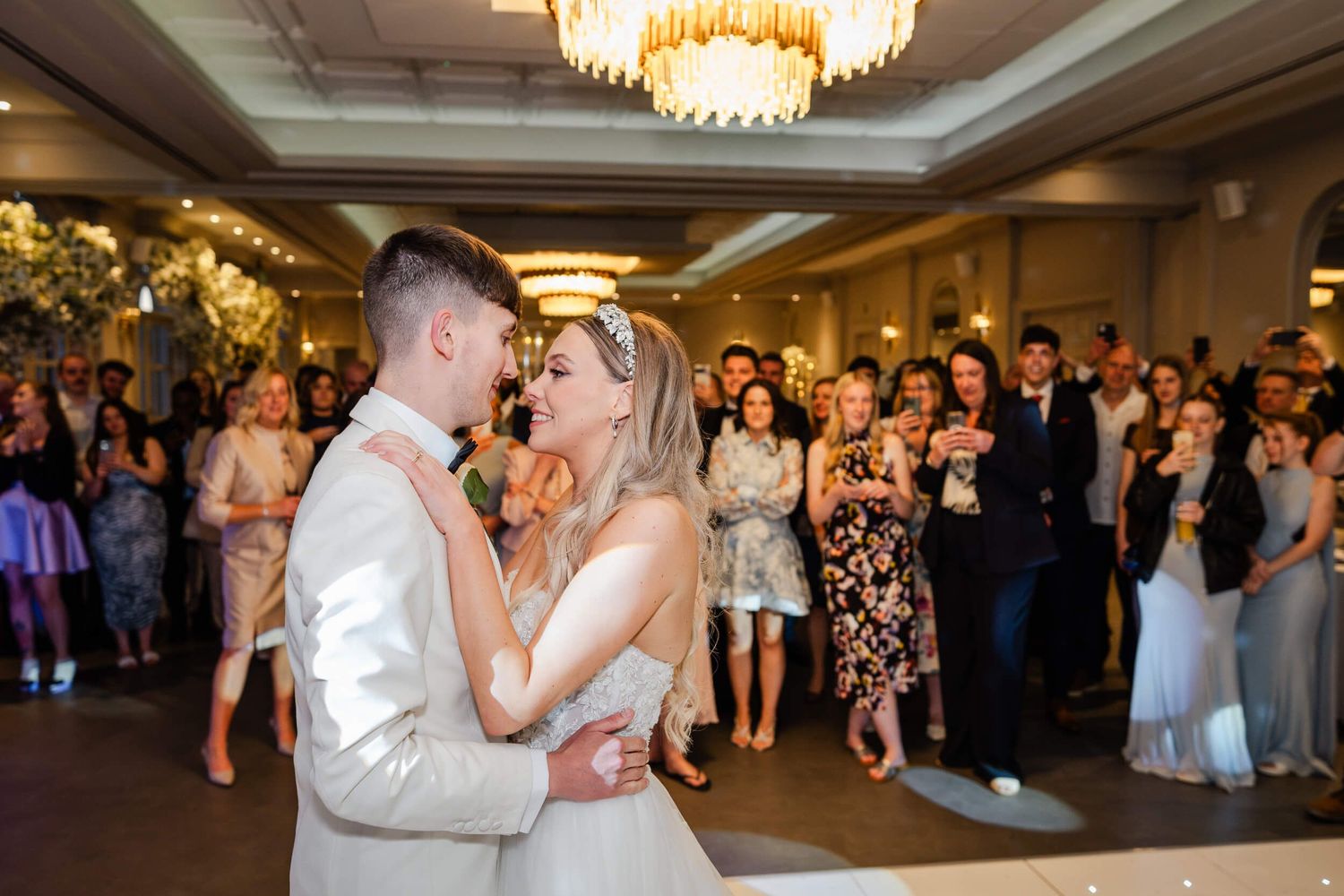 bride and groom about to kiss on the dance floor