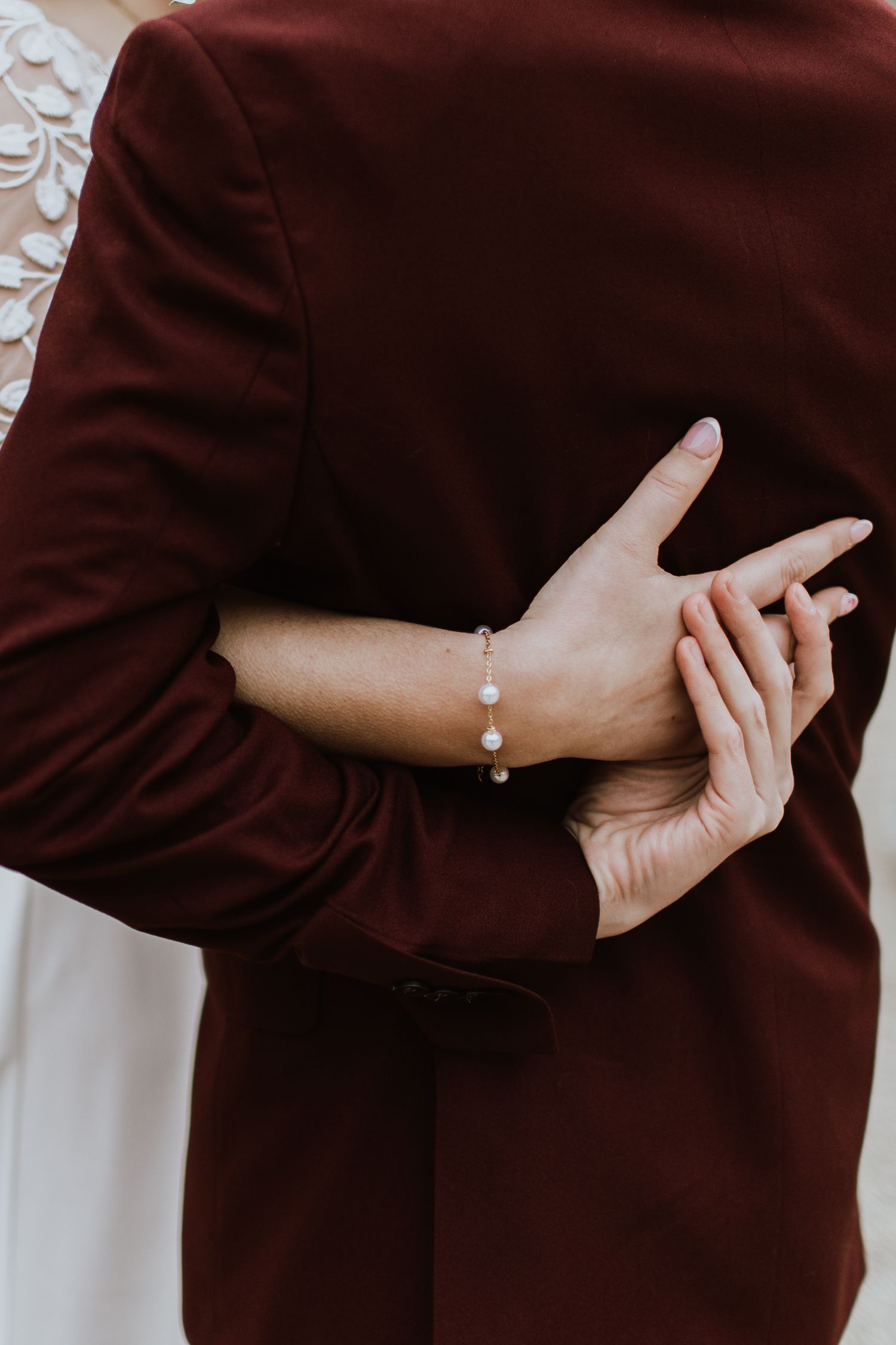 A close-up sequence of hands wearing brown fabric gesturing peace signs and movements.