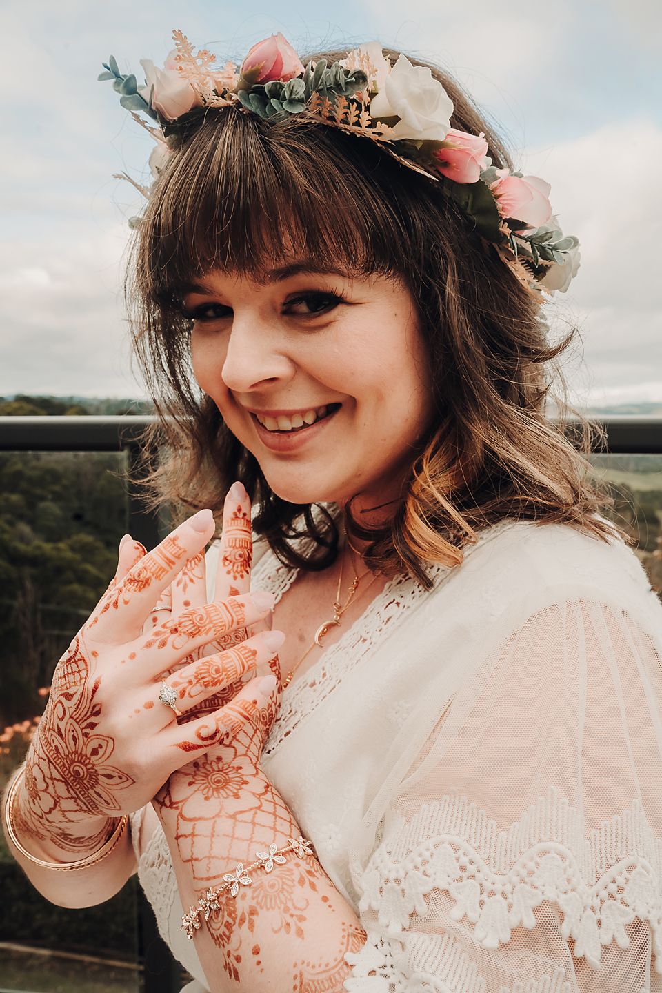 A delicate wedding photo series featuring lace details, floral crown, and joyful candid moments in warm sunlit tones.
