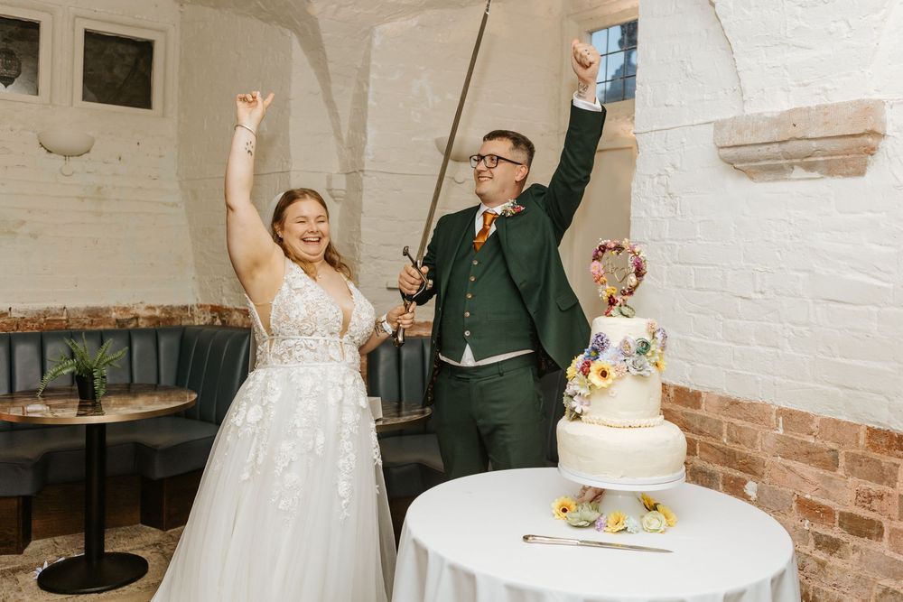 A sequence of wedding photos showing celebratory moments around a white wedding cake at an indoor reception venue.