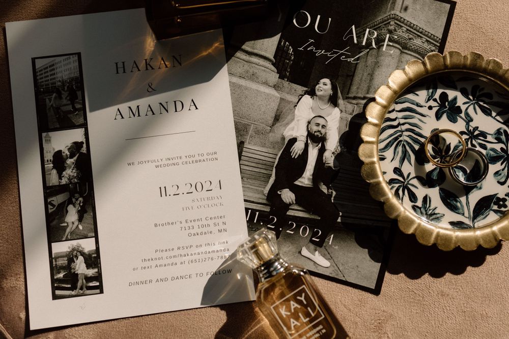 Wedding invitation and memorabilia arranged artistically with vintage photographs and decorative elements.